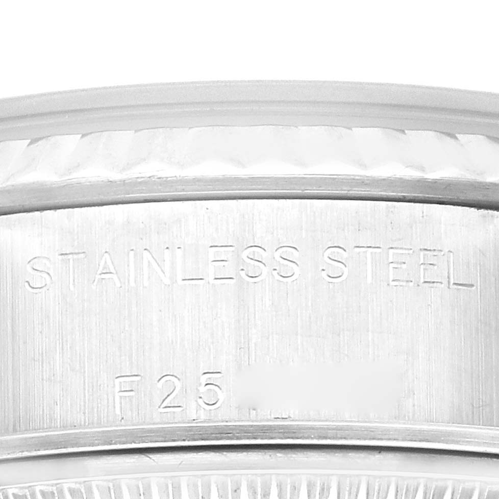 The image shows a close-up of the stainless steel casing and serial number on a Rolex Datejust 79174 Women
s Stainless Steel Silver Dial 79174 Women
s Stainless Steel Silver Dial model watch.