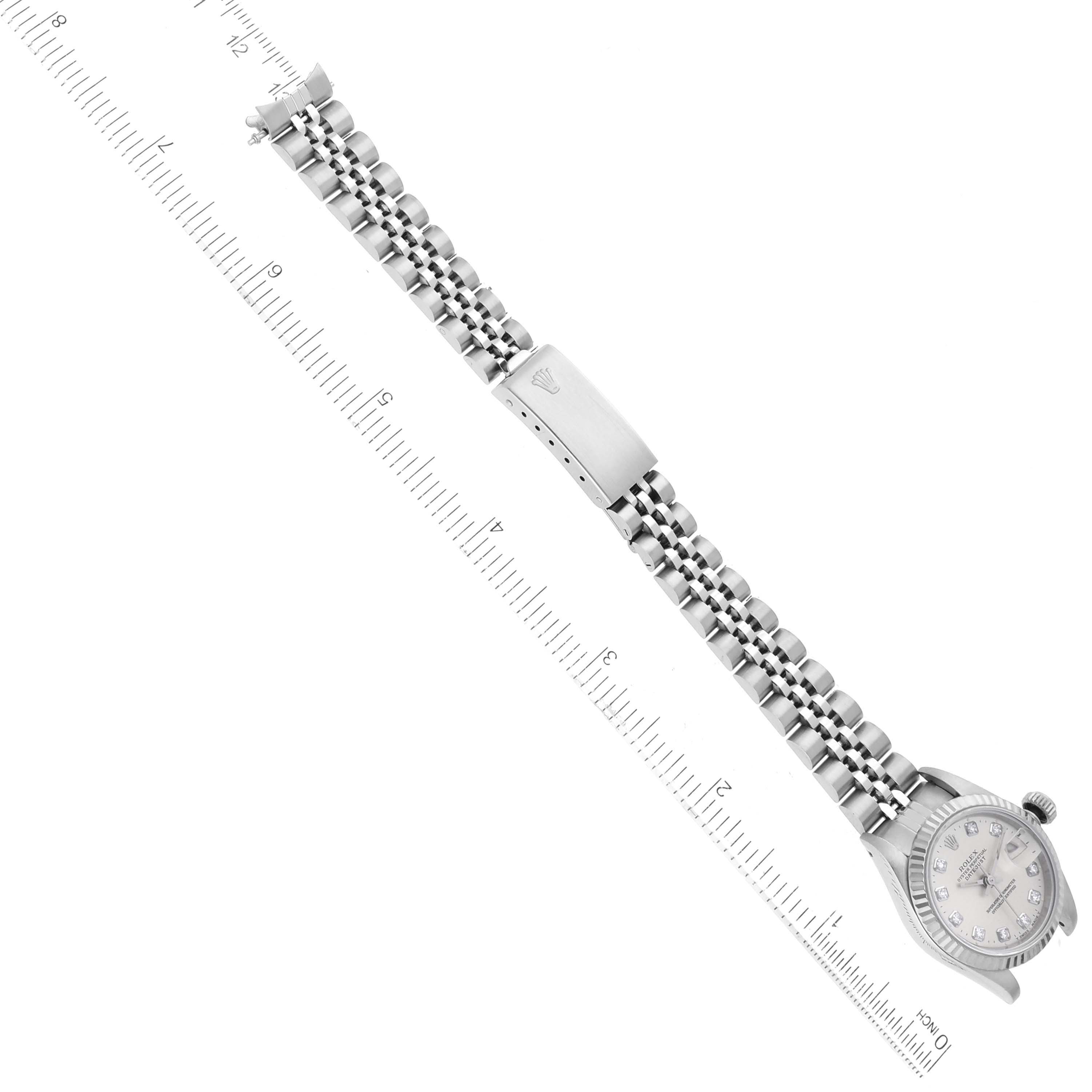 The image shows a Rolex Datejust 69174G Women's Stainless Steel Silver Dial 69174G Women's Stainless Steel Silver Dial watch laid flatly with its bracelet extended next to a ruler for size reference.