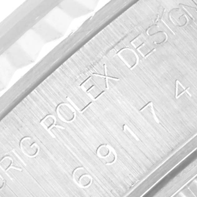 This is a close-up angle showing the engraved model and manufacturer details on a Rolex Datejust 69174G Women's Stainless Steel Silver Dial 69174G Women's Stainless Steel Silver Dial watch.