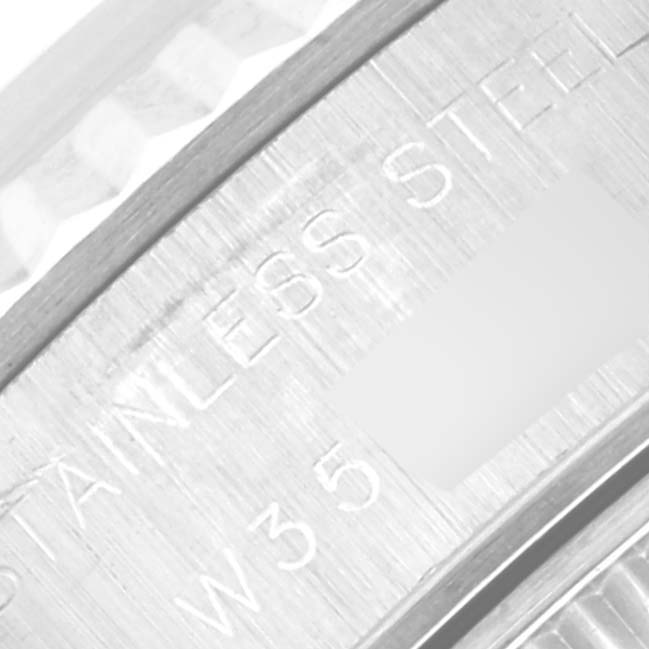This image shows a close-up angle of the side engraving on a Rolex Datejust 69174G Women's Stainless Steel Silver Dial 69174G Women's Stainless Steel Silver Dial watch, highlighting the "STAINLESS STEEL" text.
