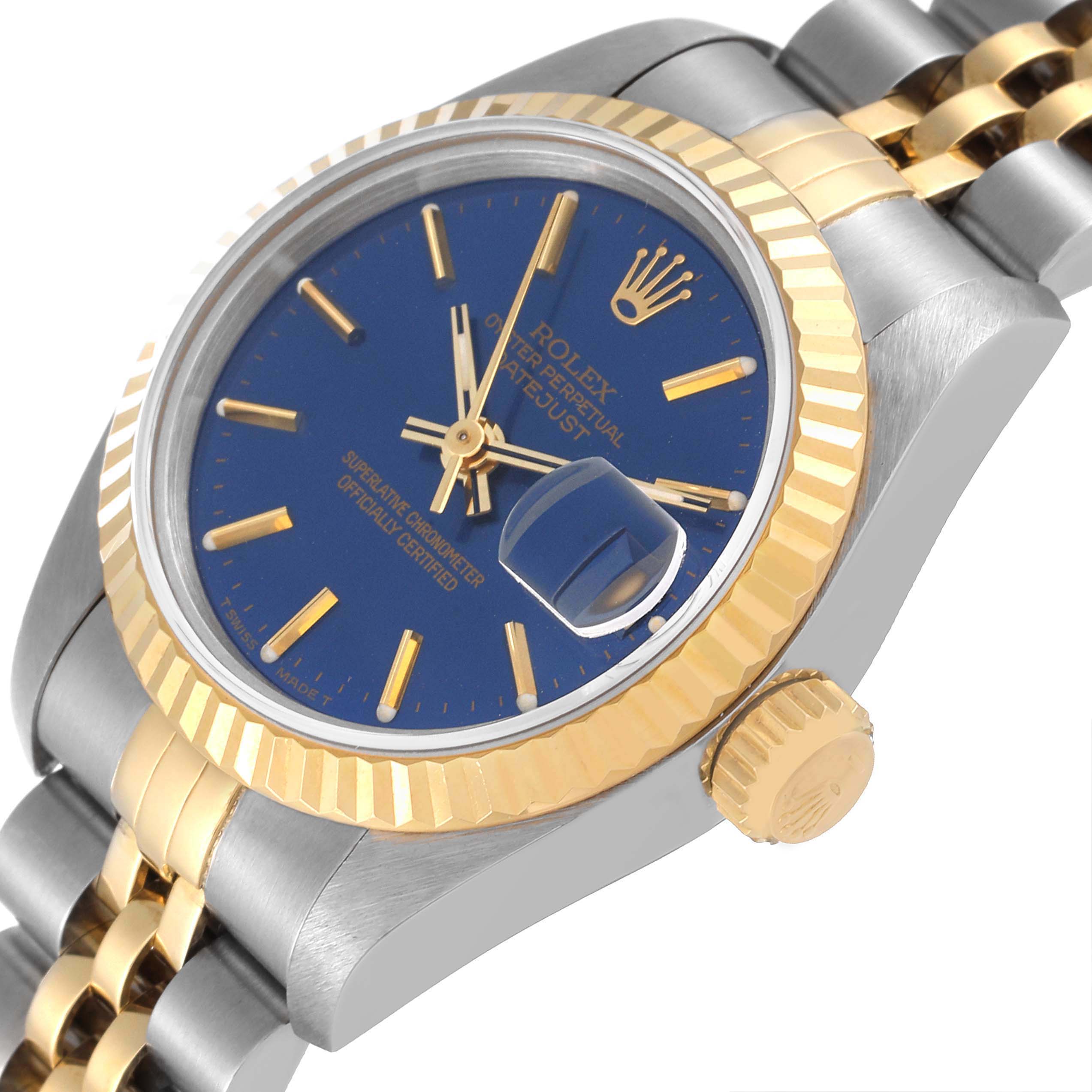 The image displays a Rolex Datejust 69173 Women's Steel and Gold (two tone) Blue Dial 69173 Women's Steel and Gold (two tone) Blue Dial watch at an angled close-up, highlighting its blue dial, gold and silver fluted bezel, and crown.