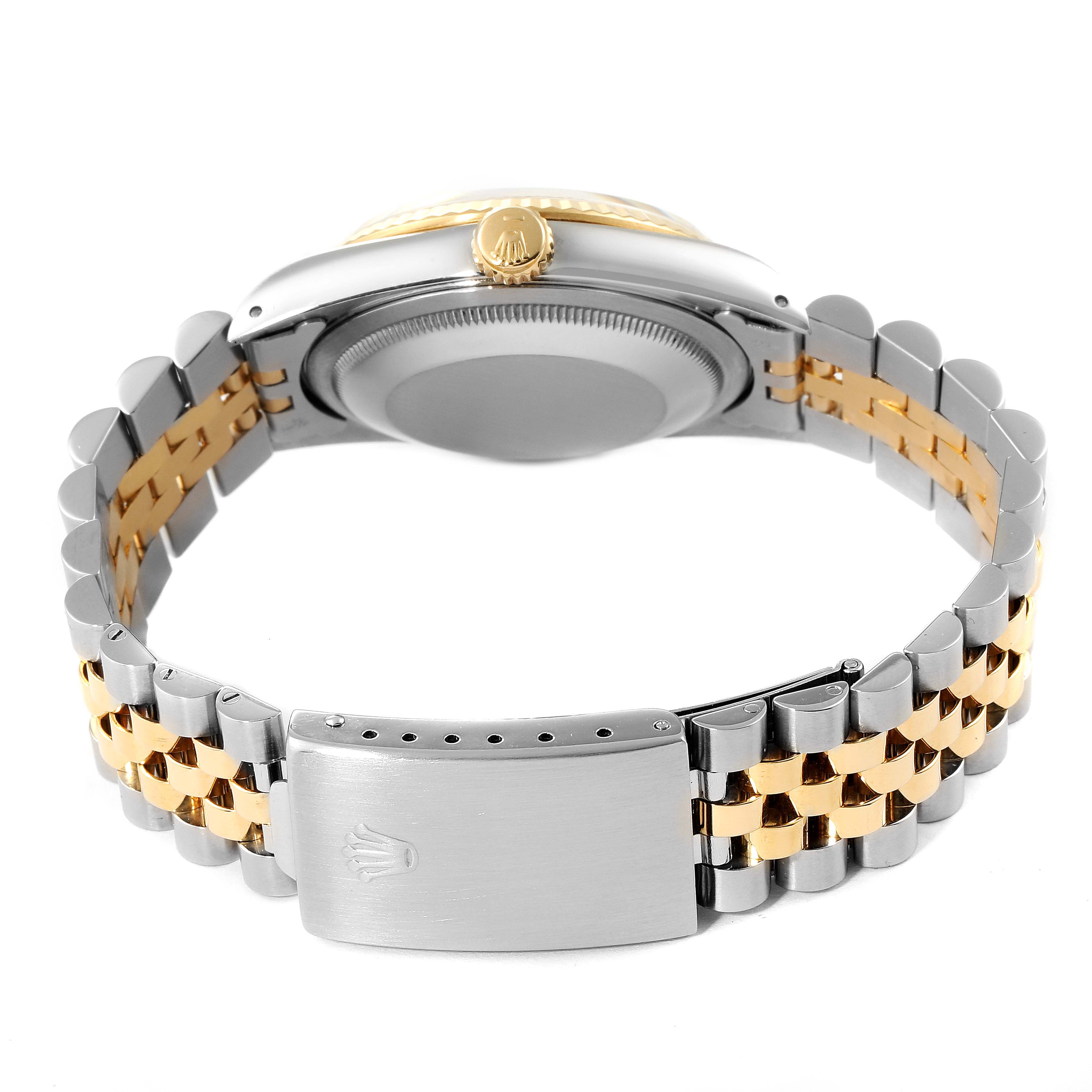 The image shows the back view of a Rolex Datejust 16233 Men's Steel and Gold (two tone) Champagne Dial 16233 Men's Steel and Gold (two tone) Champagne Dial watch, highlighting its case, two-tone Jubilee bracelet, and clasp.