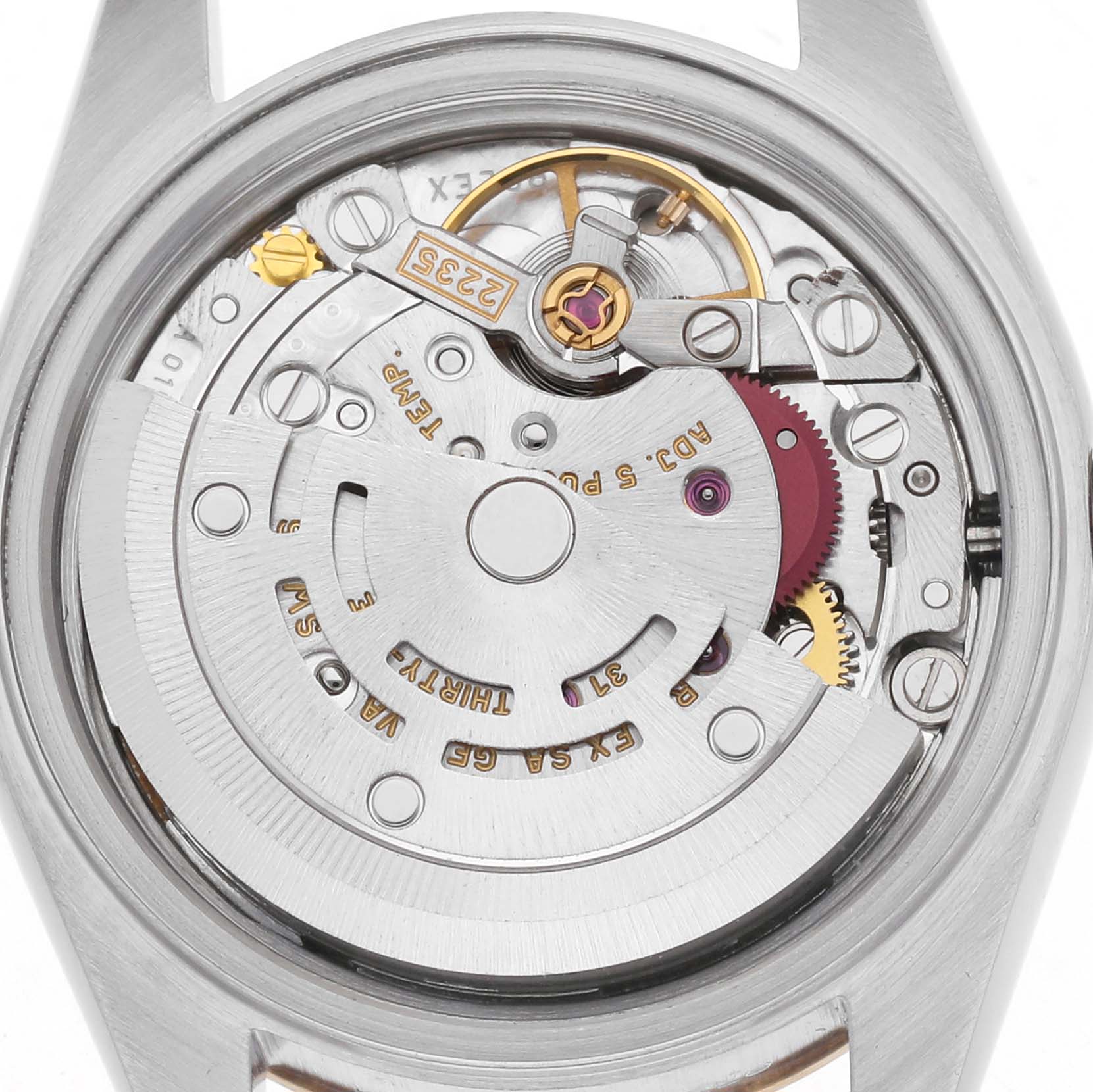 The image shows the movement of a Rolex Datejust 79173 Women
s Steel and Gold (two tone) Champagne Dial 79173 Women
s Steel and Gold (two tone) Champagne Dial watch, viewed from the back, highlighting gears and rotor.