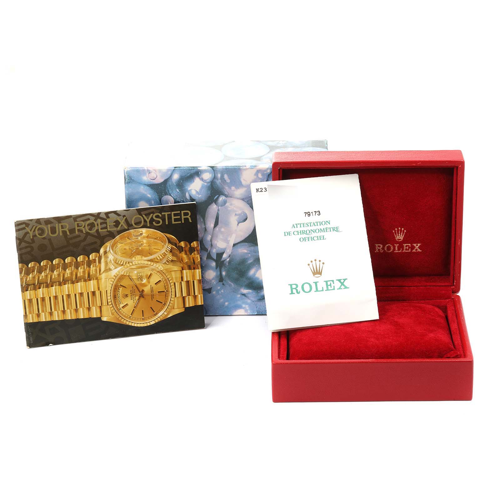 The image shows the packaging, warranty card, and instruction booklet for a Rolex Datejust 79173 Women's Steel and Gold (two tone) Silver Dial 79173 Women's Steel and Gold (two tone) Silver Dial watch from a front angle.