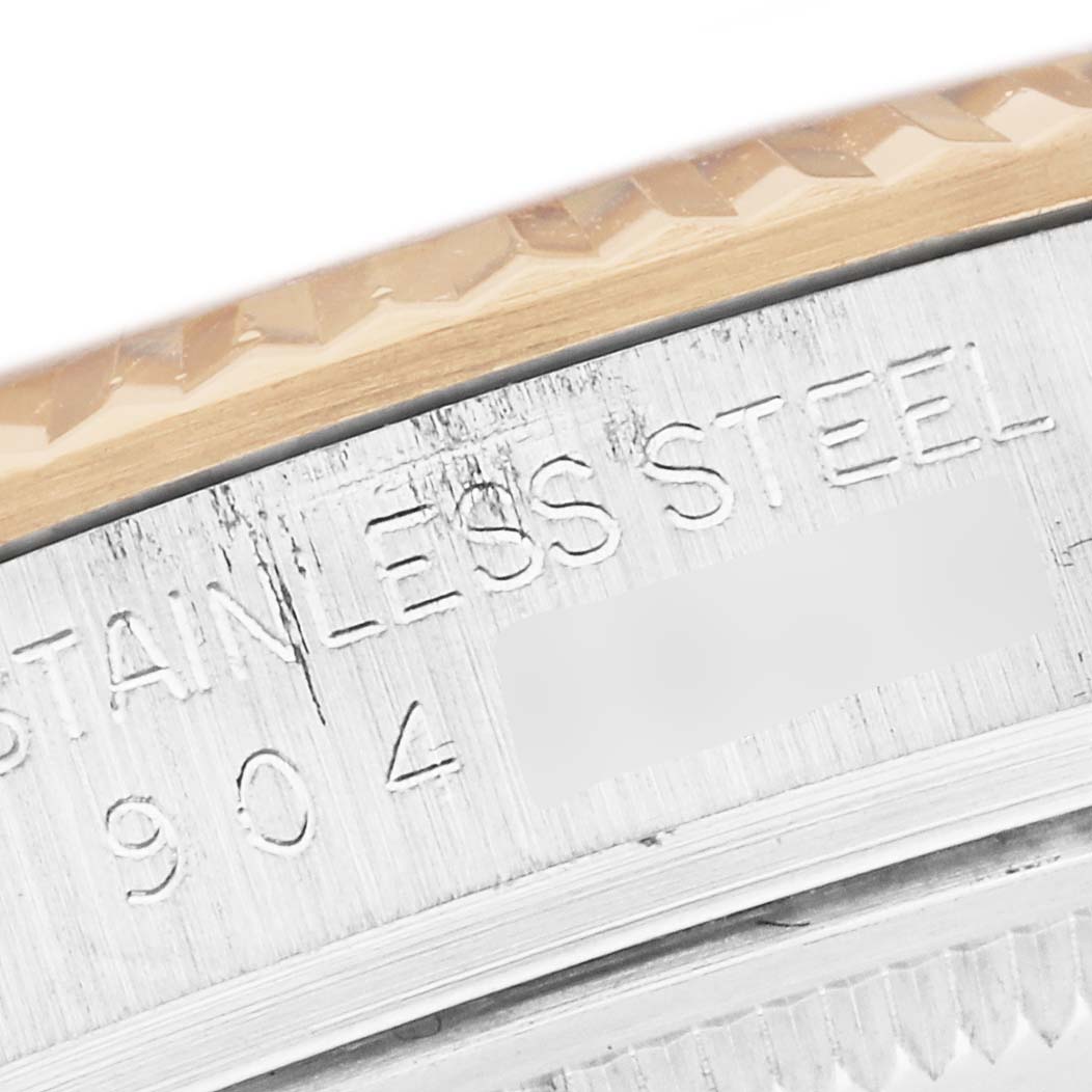 The image shows a close-up of the side engraving on a Rolex Datejust 16013 Men
s Steel and Gold (two tone) Champagne Dial 16013 Men
s Steel and Gold (two tone) Champagne Dial, featuring the stainless steel part.