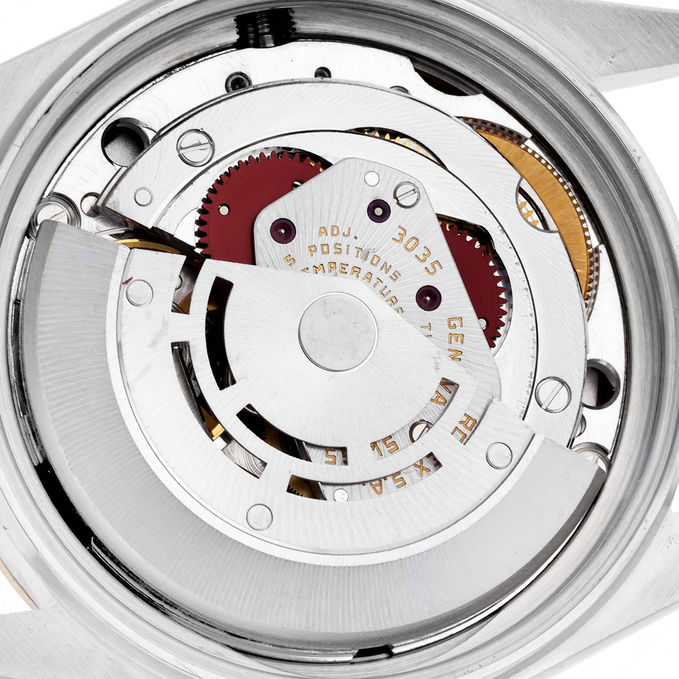 The image shows a close-up view of the movement inside a Rolex Datejust 16013 Men
s Steel and Gold (two tone) Champagne Dial 16013 Men
s Steel and Gold (two tone) Champagne Dial, highlighting gears and the rotor mechanism.