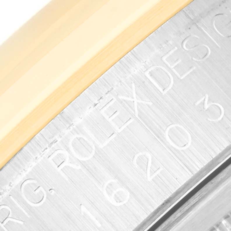 This image shows a close-up angle of the case side of a Rolex Datejust 16203 Men
s Steel and Gold (two tone) White Dial 16203 Men
s Steel and Gold (two tone) White Dial watch, highlighting the model number engraving.