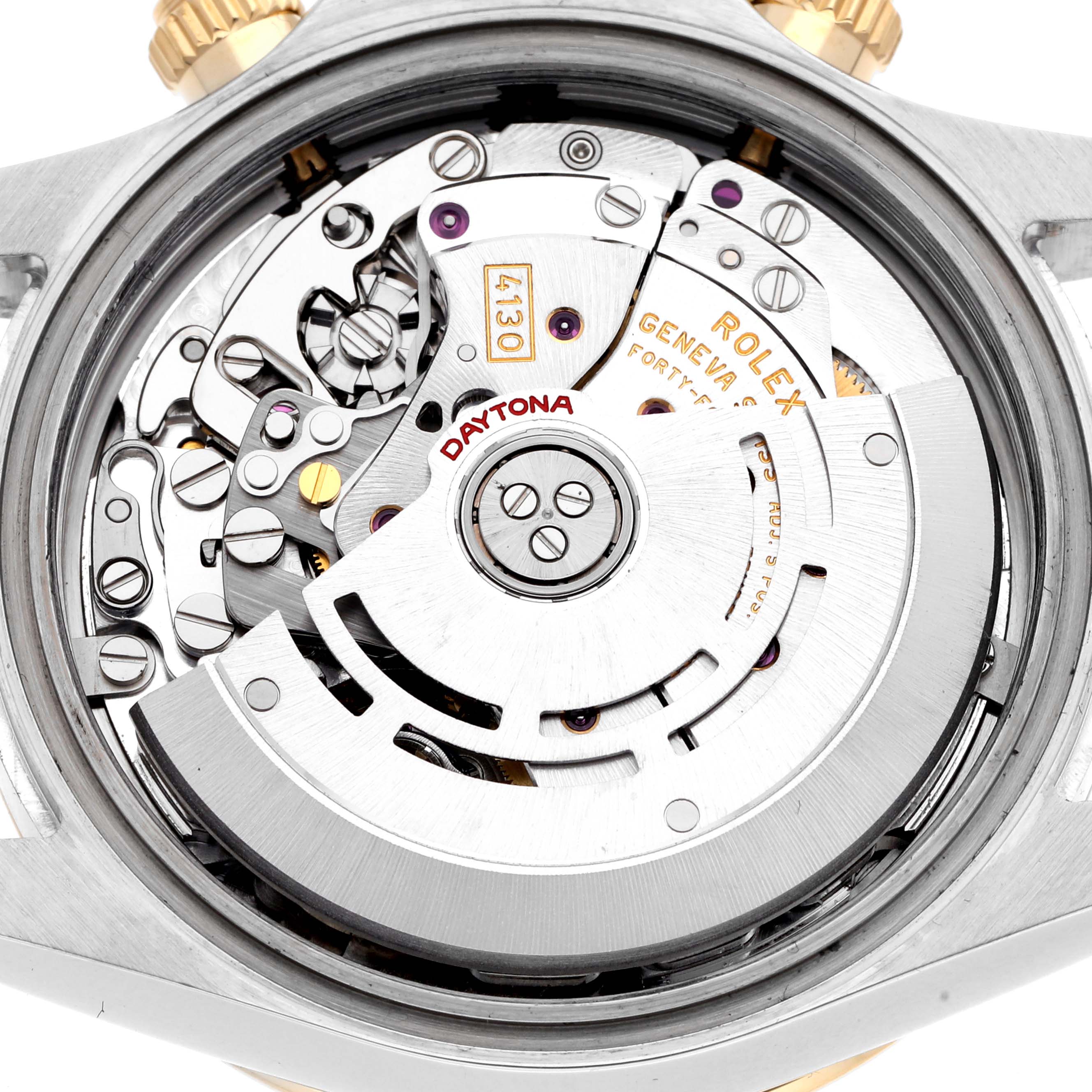 The image shows the movement of a Rolex Daytona 116523 Men
s Steel and Gold (two tone) White Dial 116523 Men
s Steel and Gold (two tone) White Dial watch from a top-down angle, highlighting its intricate internal mechanisms.