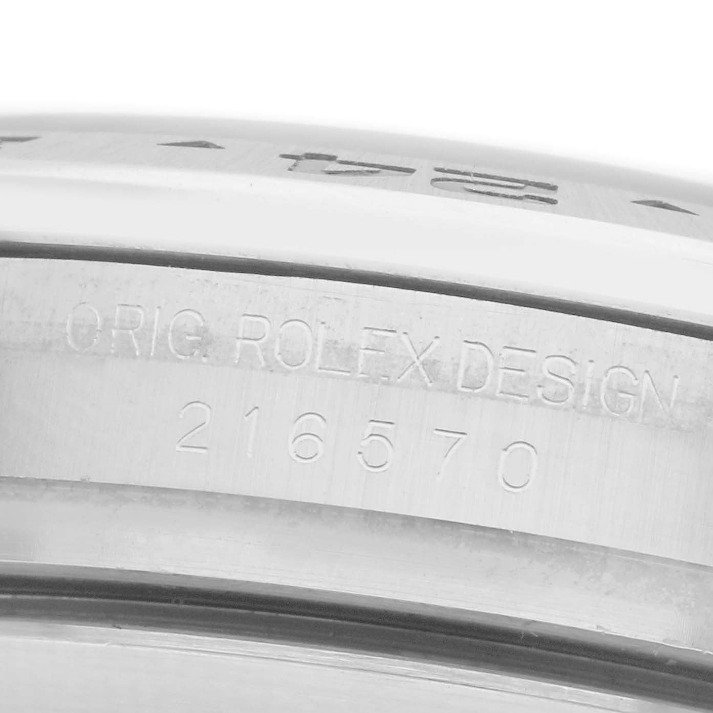 The image shows a close-up of the inner side of a Rolex Explorer 216570 Men
s Stainless Steel Black Dial 216570 Men
s Stainless Steel Black Dial
s bezel, featuring engravings.