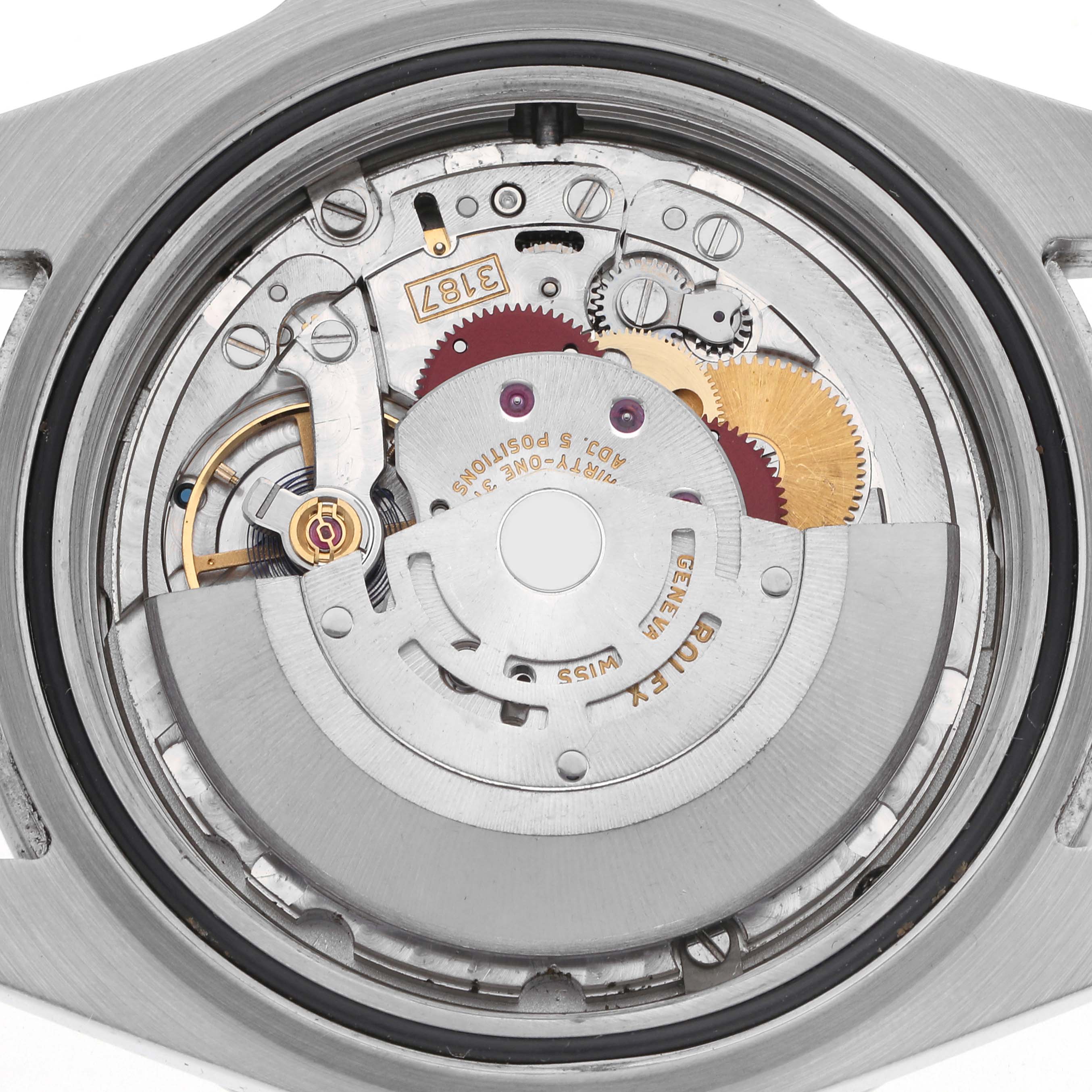 The image shows the movement of a Rolex Explorer 216570 Men
s Stainless Steel Black Dial 216570 Men
s Stainless Steel Black Dial model, viewed from the back, highlighting gears and the rotor.