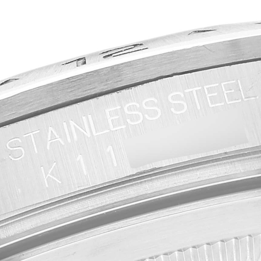 This close-up image shows the engraved side details of a stainless steel Rolex Explorer 16570 Men's Stainless Steel Black Dial 16570 Men's Stainless Steel Black Dial model watch.