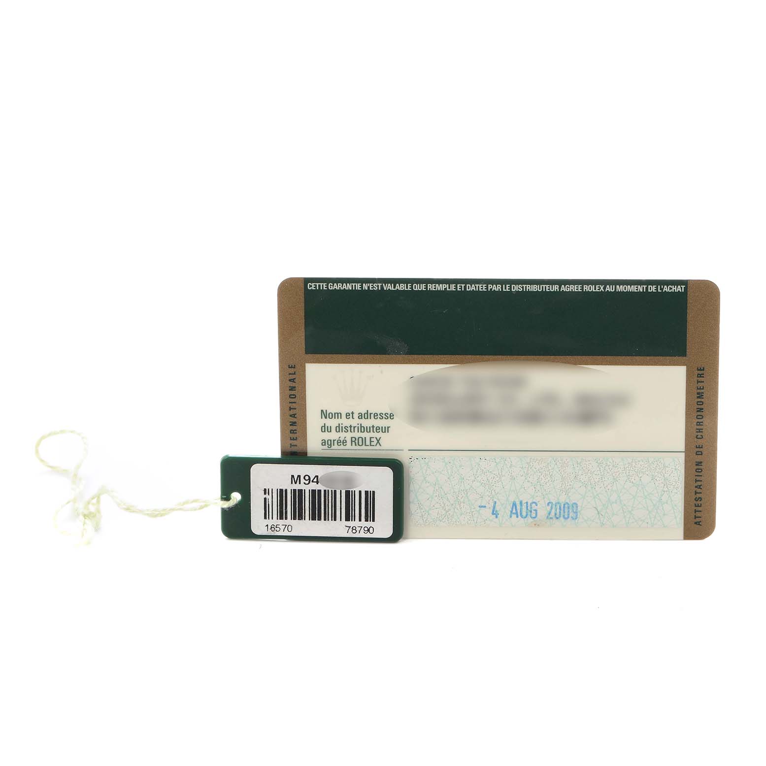 The image shows a Rolex Explorer 16570 Men
s Stainless Steel Black Dial 16570 Men
s Stainless Steel Black Dial model tag and warranty card with a visible date, placed against a neutral background.