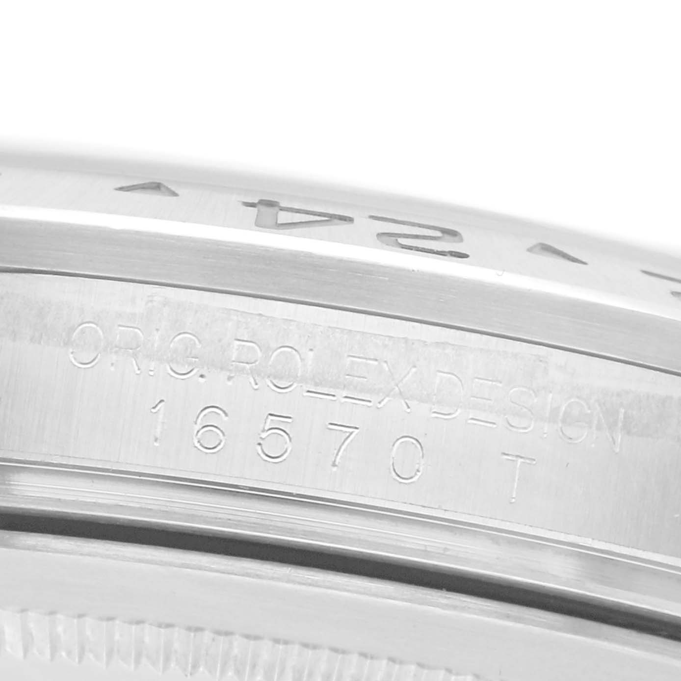 The image shows a close-up of the case side with engravings of the Rolex Explorer 16570 Men
s Stainless Steel Black Dial 16570 Men
s Stainless Steel Black Dial model, showcasing the design and model number.