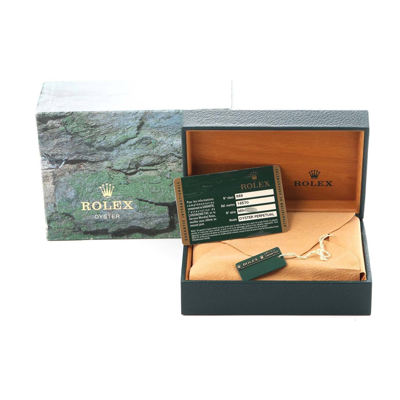 The image shows the packaging and accessories for a Rolex Explorer 16570 Men
s Stainless Steel Black Dial 16570 Men
s Stainless Steel Black Dial, including the box, warranty card, and tags, viewed from the front.