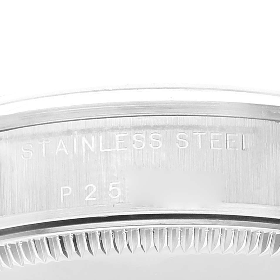 The image shows a close-up of the engraving on the stainless steel case back of a Rolex Mid-Size 77080 Women
s Stainless Steel Pink Dial 77080 Women
s Stainless Steel Pink Dial model watch.