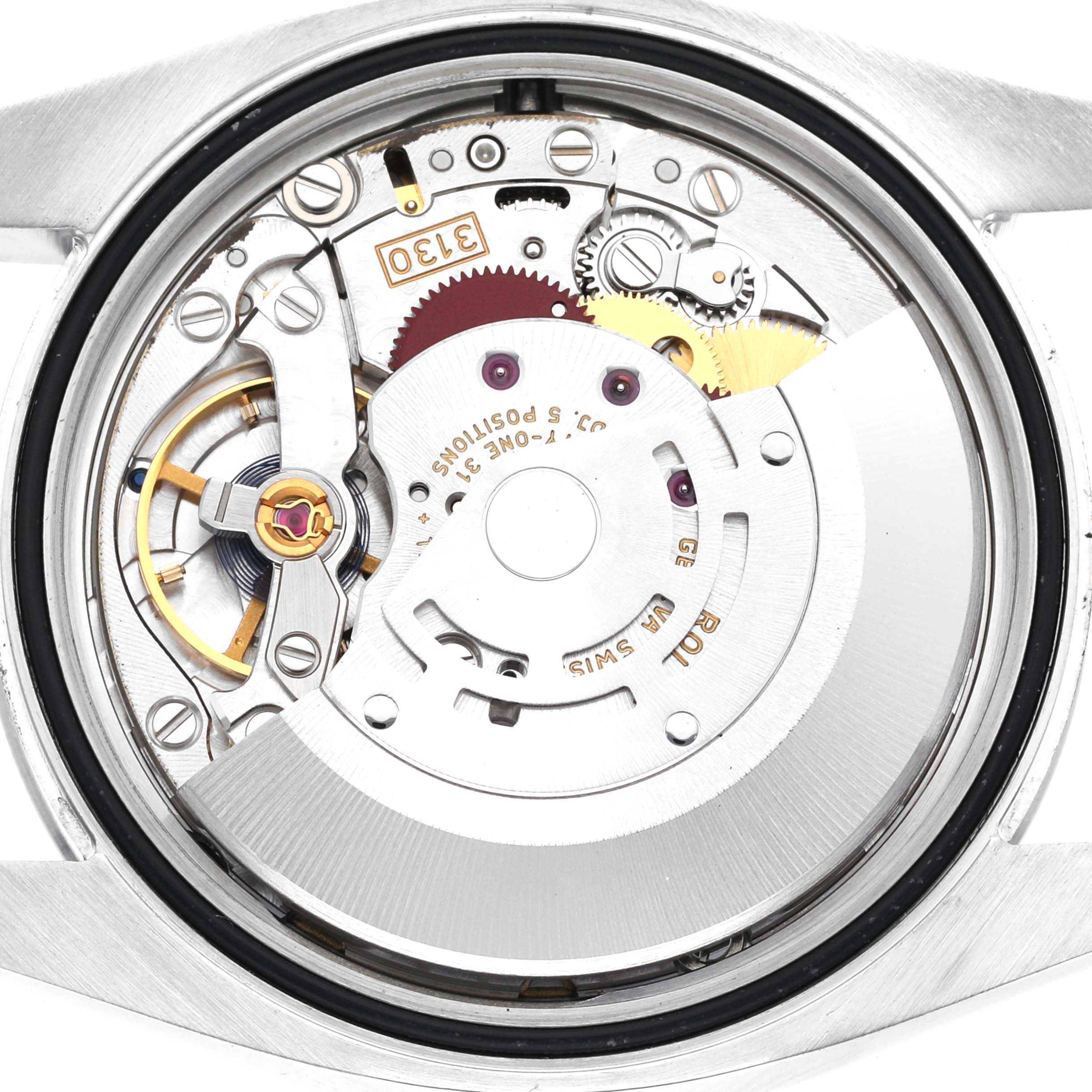 The image shows the movement mechanism of the Rolex Oyster Perpetual 116000 Men
s Stainless Steel Blue Dial 116000 Men
s Stainless Steel Blue Dial watch from a rear angle with its parts exposed.