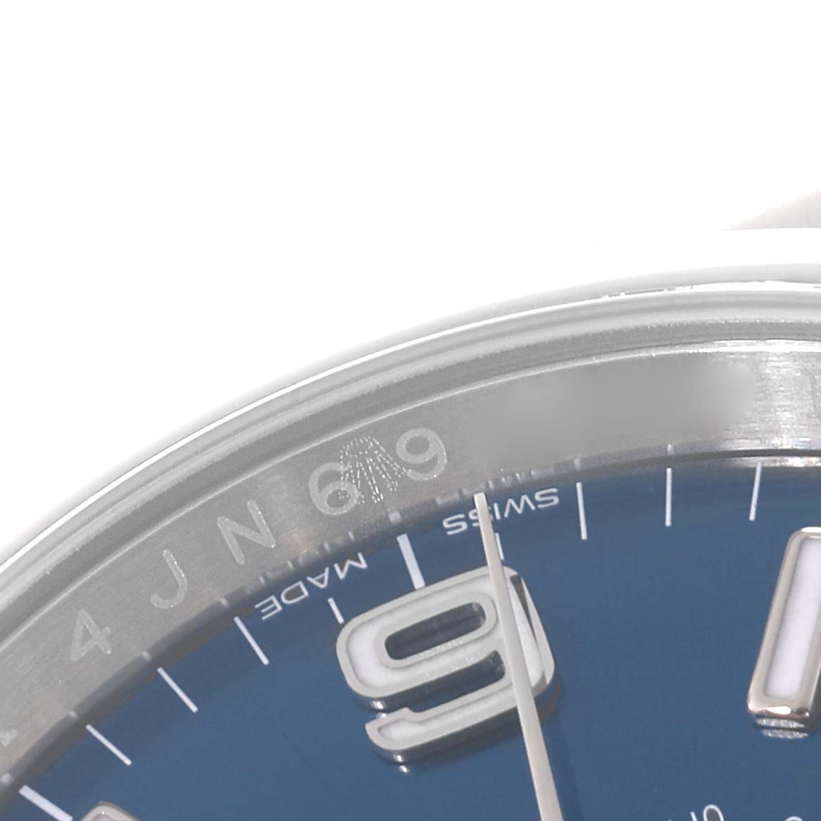 The close-up image shows the dial and part of the bezel of the Rolex Oyster Perpetual 116000 Men
s Stainless Steel Blue Dial 116000 Men
s Stainless Steel Blue Dial watch, highlighting the "6 9" markers and the text "SWISS MADE."