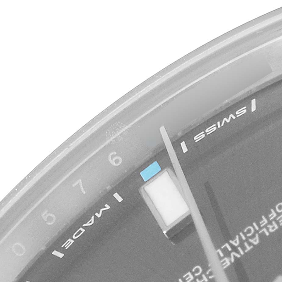 This image shows a close-up of the dial, hour marker, and minute hand of a Rolex Oyster Perpetual 114300 Men
s Stainless Steel Silver Dial 114300 Men
s Stainless Steel Silver Dial watch.