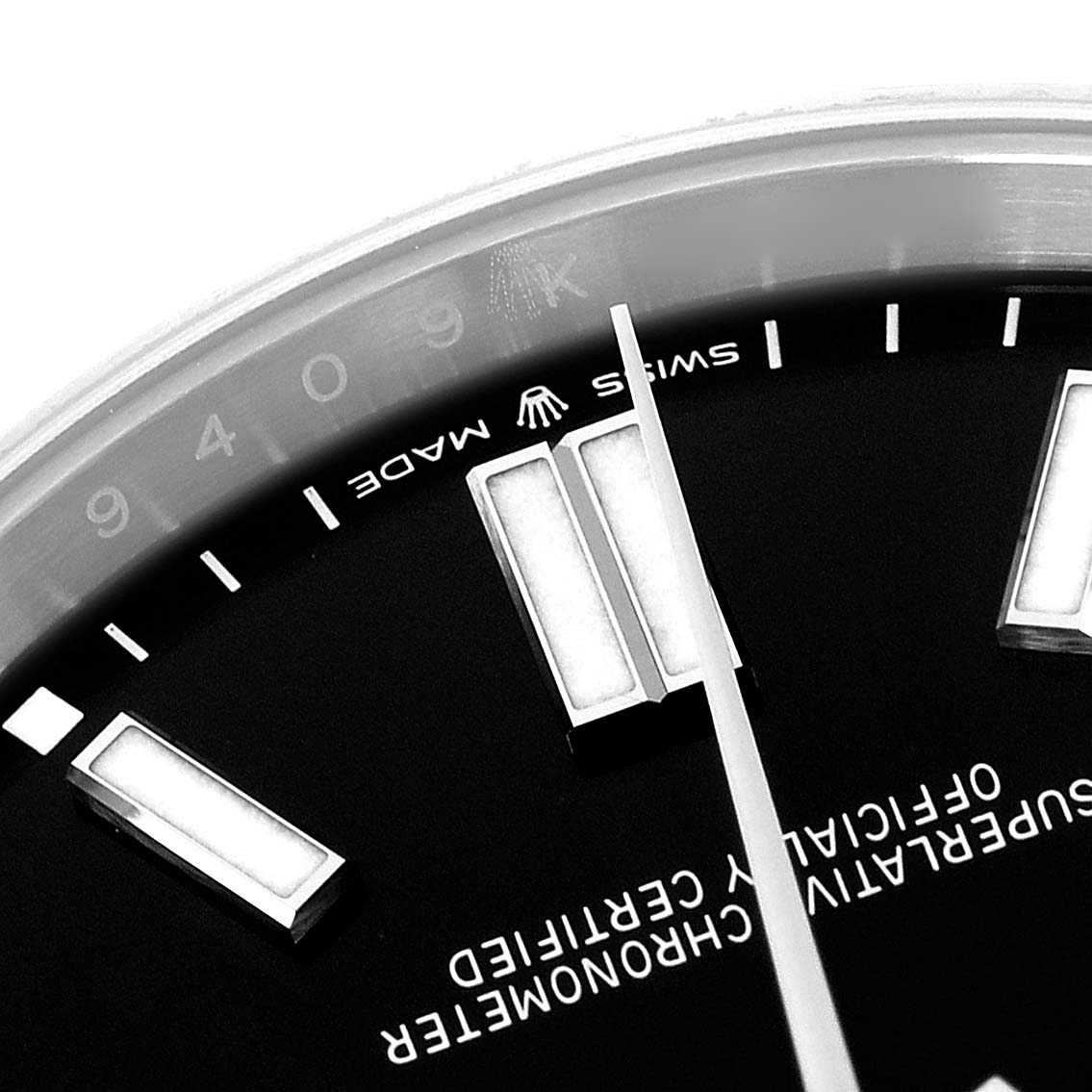 The image shows a close-up angle of the dial and hour markers of a Rolex Oyster Perpetual 124300 Men
s Stainless Steel Black Dial 124300 Men
s Stainless Steel Black Dial watch.