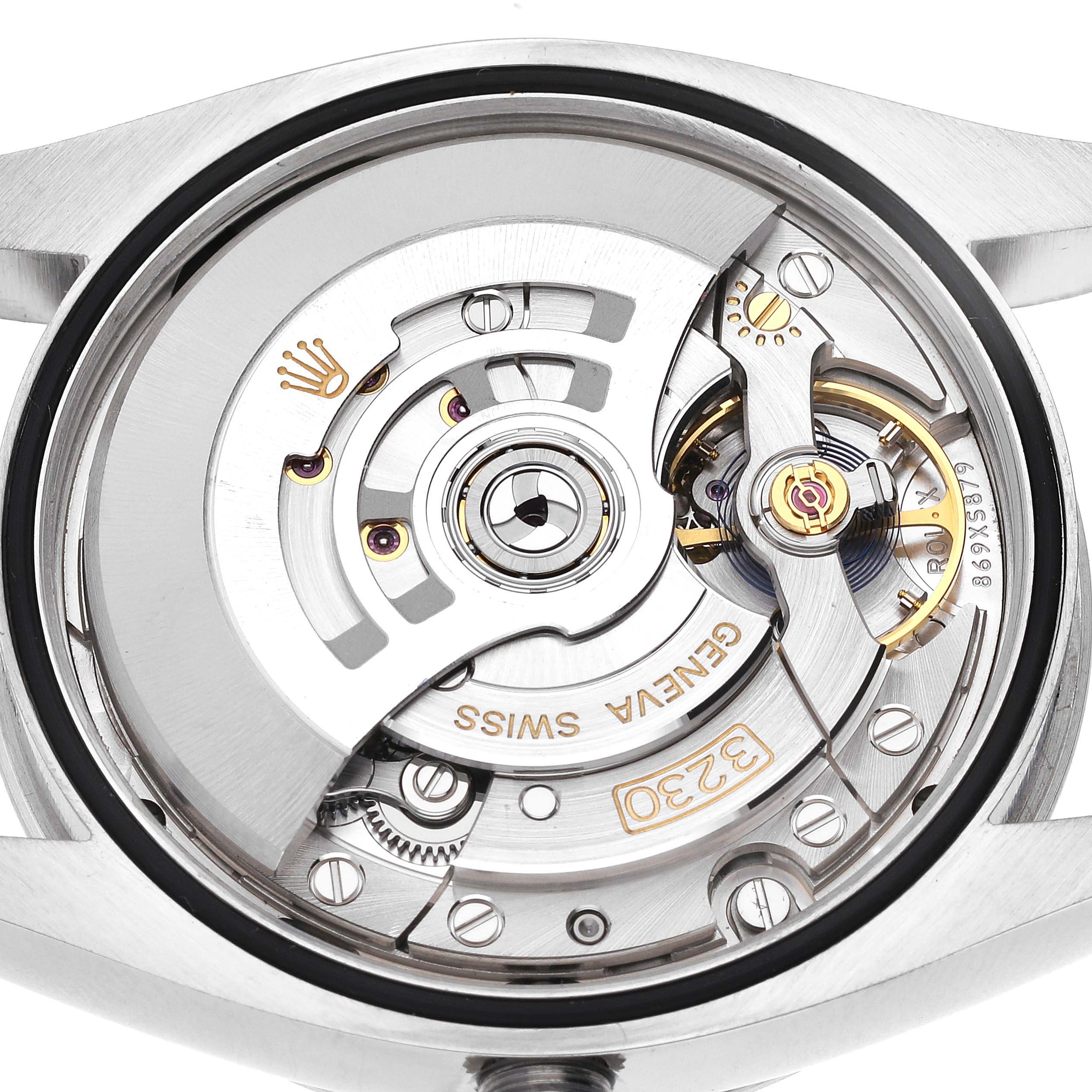 This image shows the intricate internal mechanics and movement of a Rolex Oyster Perpetual 126000 Men's Stainless Steel Red Dial 126000 Men's Stainless Steel Red Dial model from a back-facing angle.