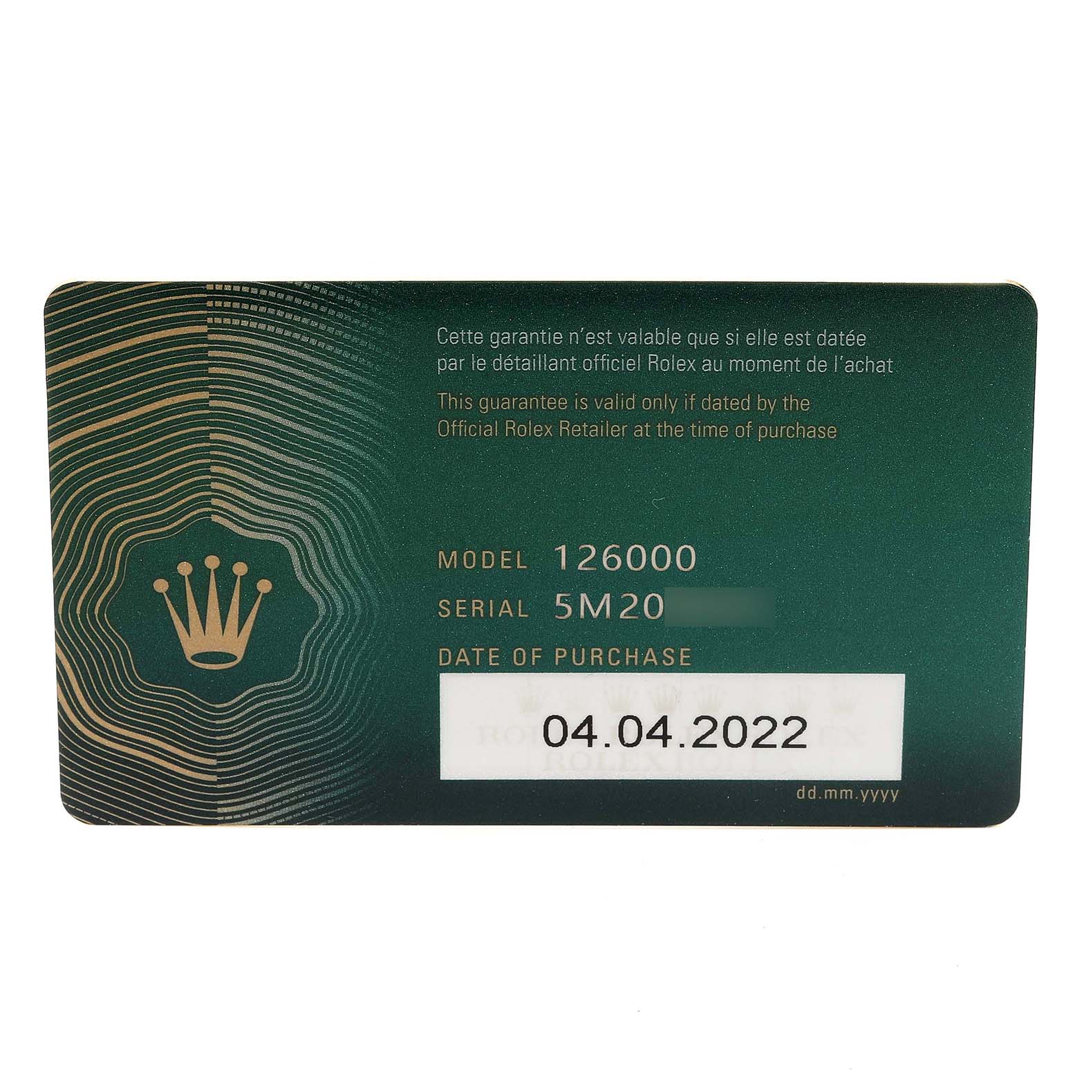 This is a guarantee card for a Rolex Oyster Perpetual 126000 Men
s Stainless Steel Green Dial 126000 Men
s Stainless Steel Green Dial model 126000, showing the serial number and date of purchase.