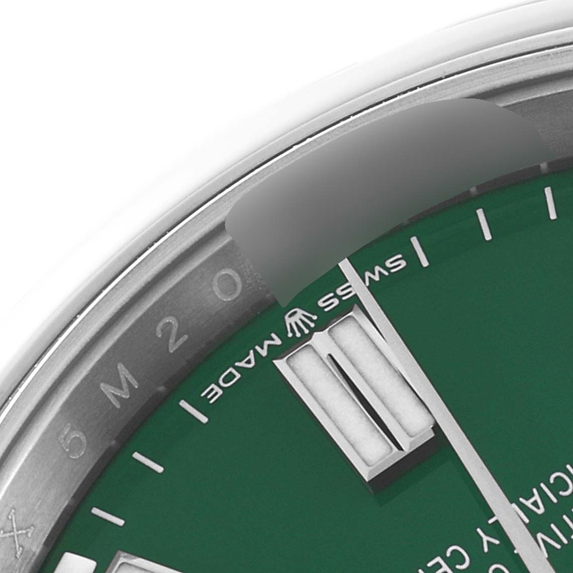 This close-up image shows the dial, bezel, and minute markers of the Rolex Oyster Perpetual 126000 Men
s Stainless Steel Green Dial 126000 Men
s Stainless Steel Green Dial watch.