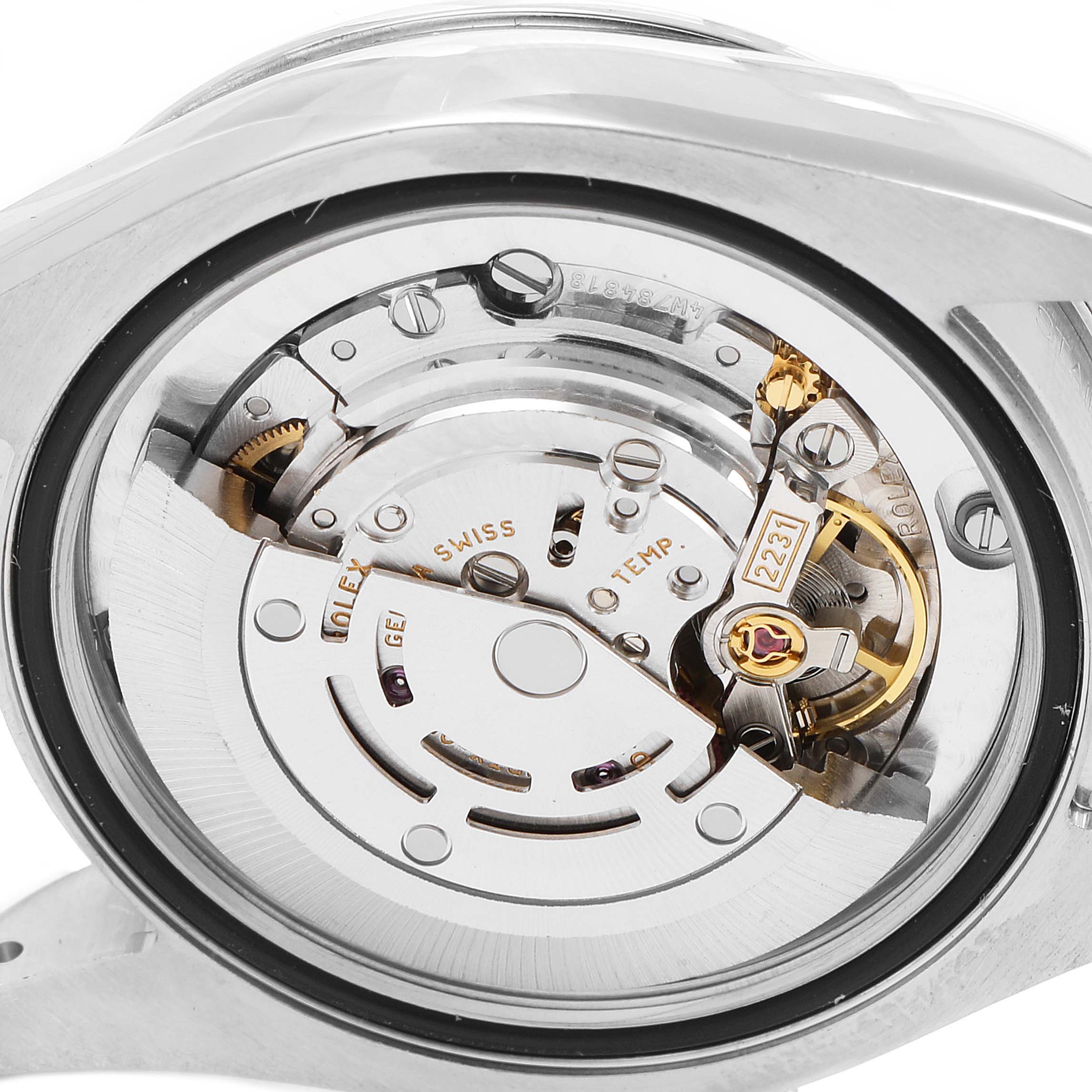 The image shows the internal movement mechanism of a Rolex Mid-Size 177200 Women
s Stainless Steel Blue Dial 177200 Women
s Stainless Steel Blue Dial watch from a rear angle.