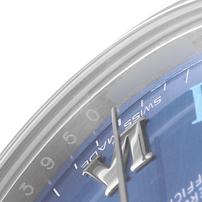 The image shows a close-up of the Rolex Mid-Size 177200 Women
s Stainless Steel Blue Dial 177200 Women
s Stainless Steel Blue Dial watch face, focusing on the "Swiss Made" text, hour markers, and part of the minute hand.