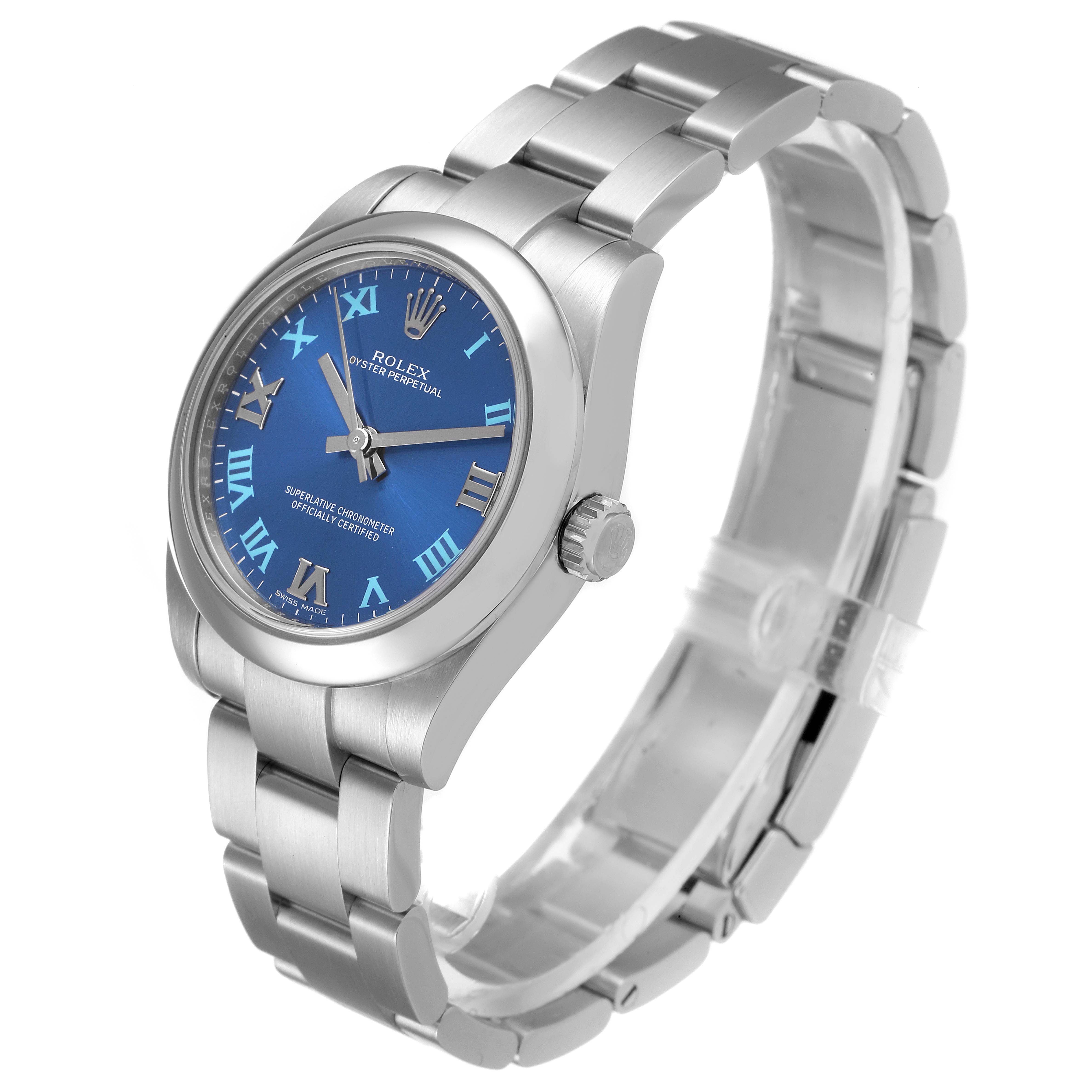The image shows a Rolex Mid-Size 177200 Women
s Stainless Steel Blue Dial 177200 Women
s Stainless Steel Blue Dial model watch with a blue dial, silver bracelet, and crown, viewed from a side angle.