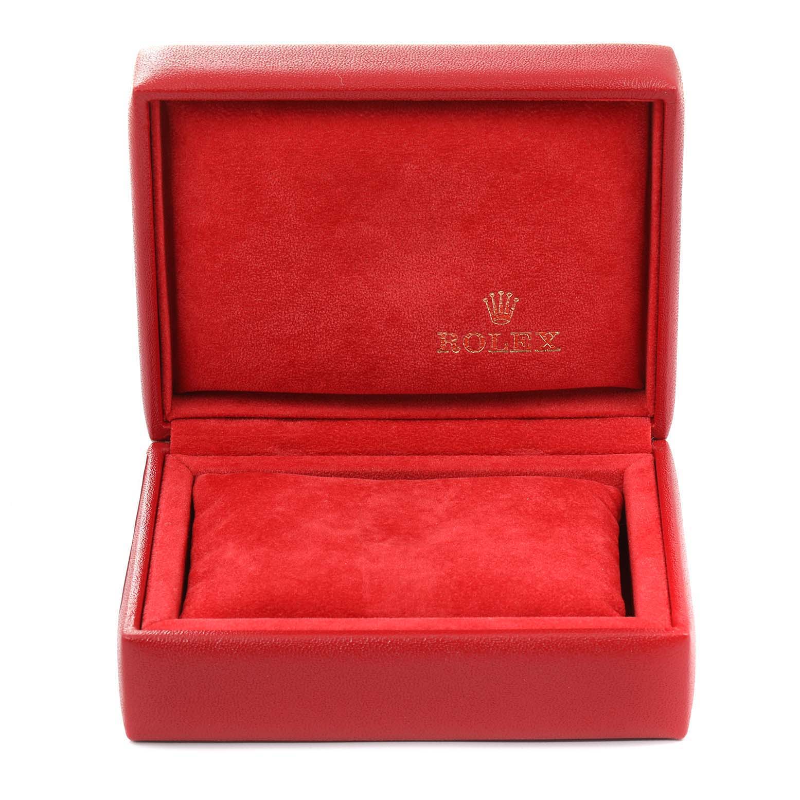 This image shows an open, empty red Rolex watch box, designed for the Oyster Perpetual model.