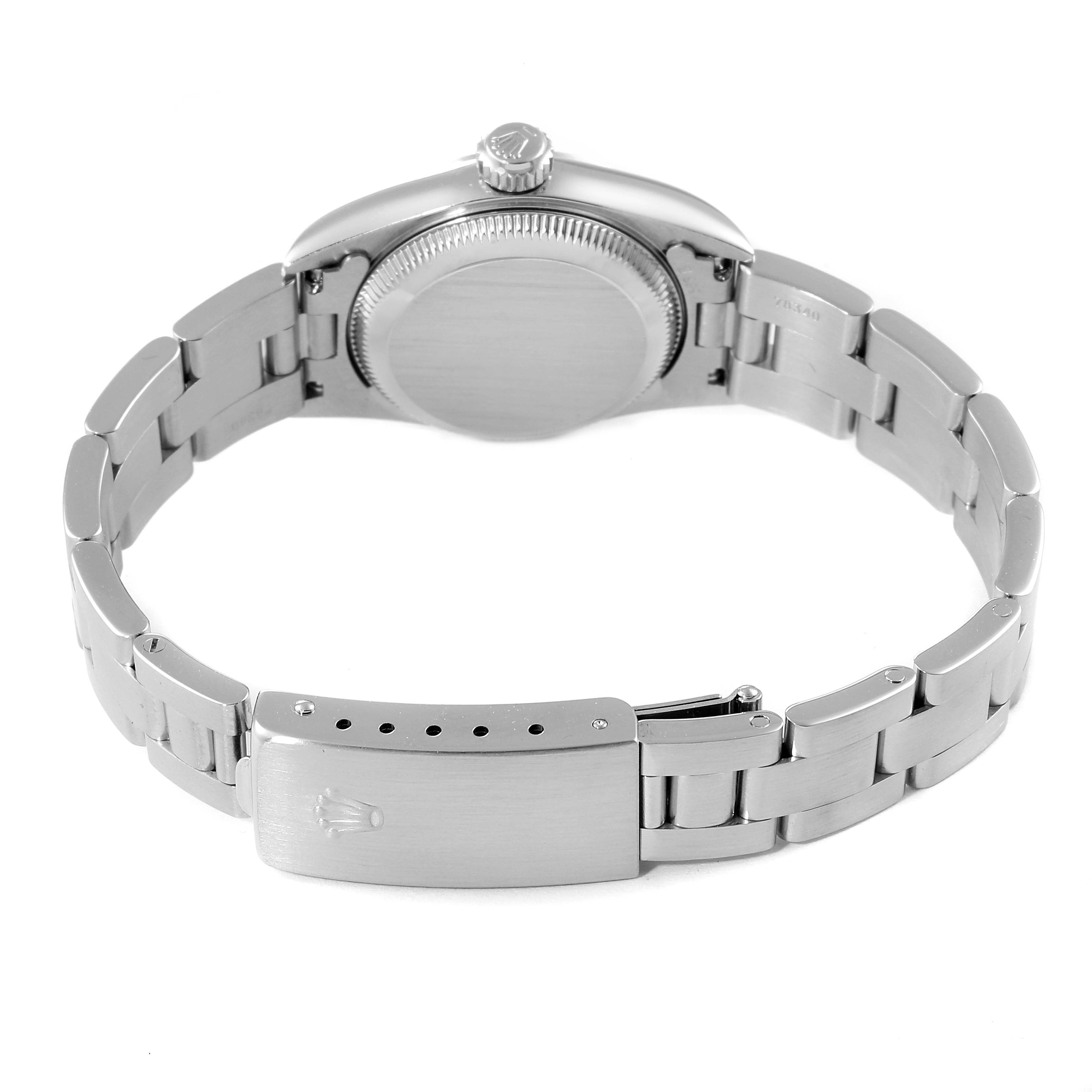 The image shows the backside and clasp of a Rolex Oyster Perpetual 67180 Women's Stainless Steel Blue Dial 67180 Women's Stainless Steel Blue Dial watch, highlighting its bracelet and caseback.