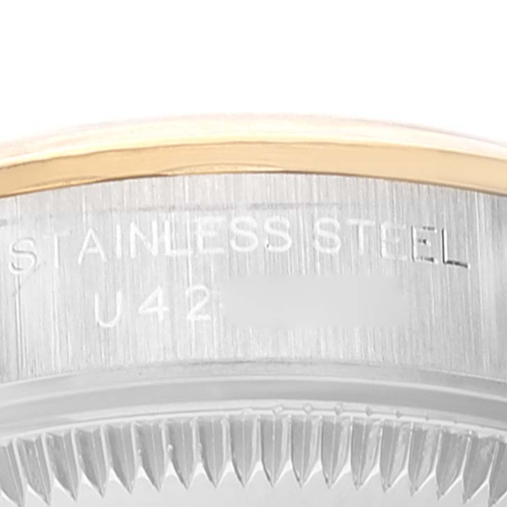 This image shows a close-up of the side of a Rolex Oyster Perpetual 67183 Women's Steel and Gold (two tone) Grey Dial 67183 Women's Steel and Gold (two tone) Grey Dial watch, highlighting the stainless steel and part of the bezel.