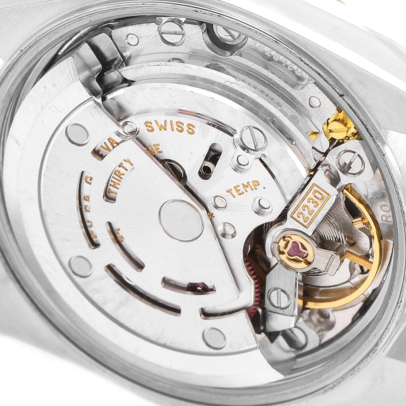 The image shows a close-up view of the movement mechanism of a Rolex Oyster Perpetual 76183 Women's Steel and Gold (two tone) Grey Dial 76183 Women's Steel and Gold (two tone) Grey Dial watch.
