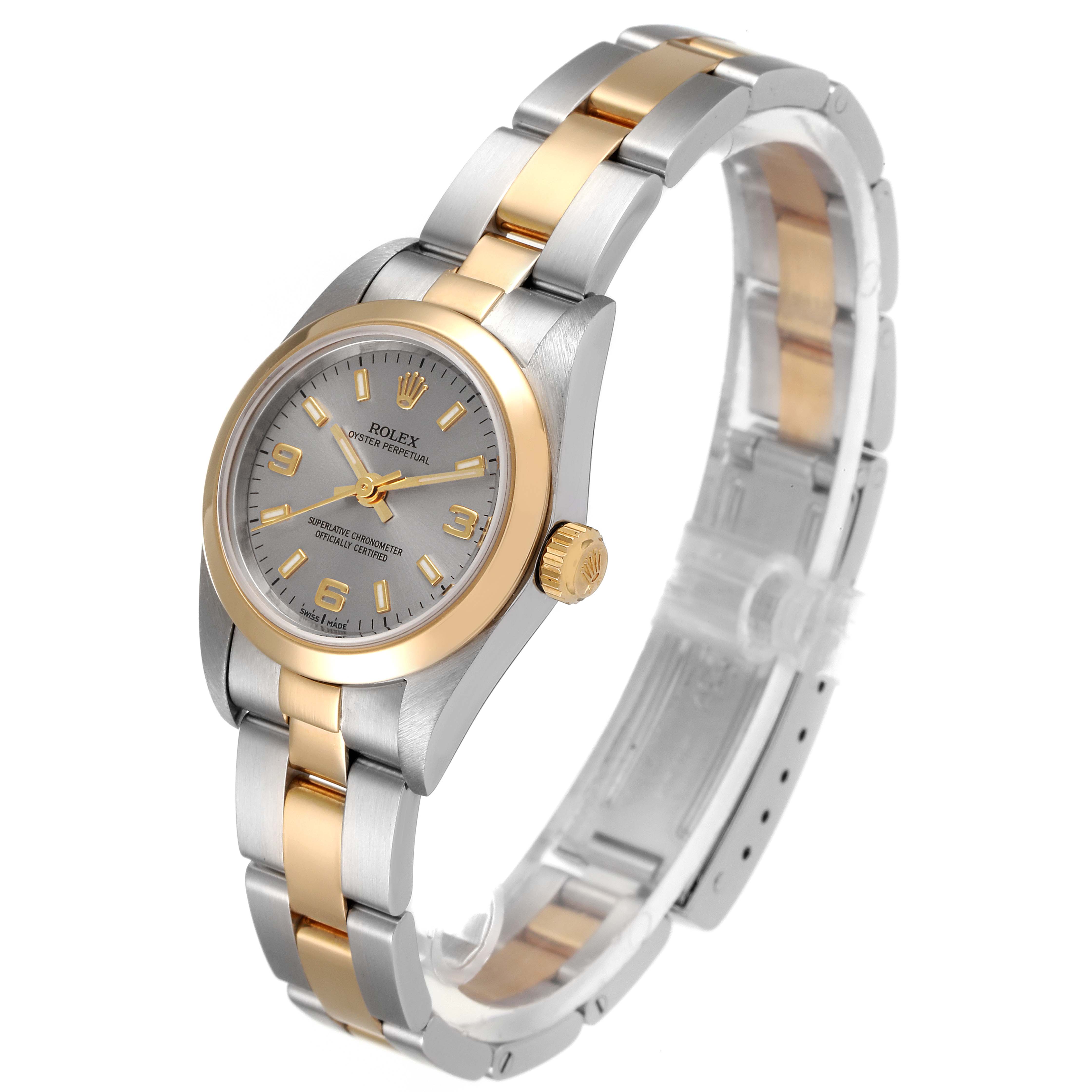 The image shows a Rolex Oyster Perpetual 76183 Women's Steel and Gold (two tone) Grey Dial 76183 Women's Steel and Gold (two tone) Grey Dial watch angled from the top-right, highlighting the face, bezel, crown, and bracelet.