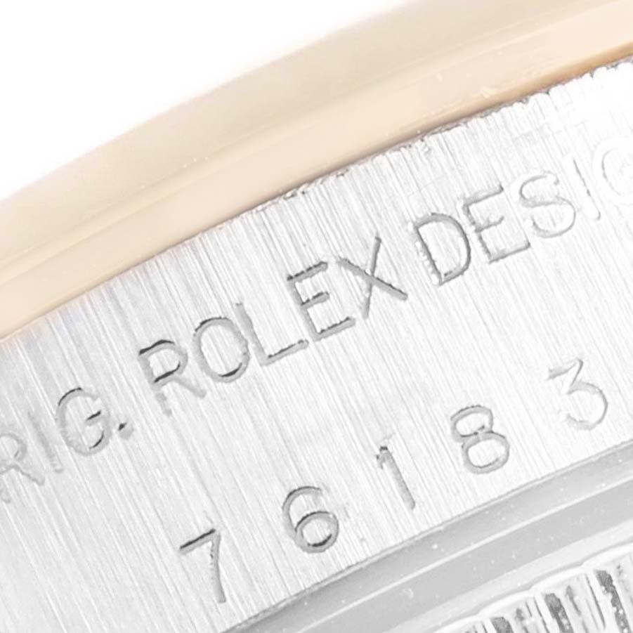This is a close-up of the back casing of a Rolex Oyster Perpetual 76183 Women's Steel and Gold (two tone) Grey Dial 76183 Women's Steel and Gold (two tone) Grey Dial watch, showing the engraved model details.