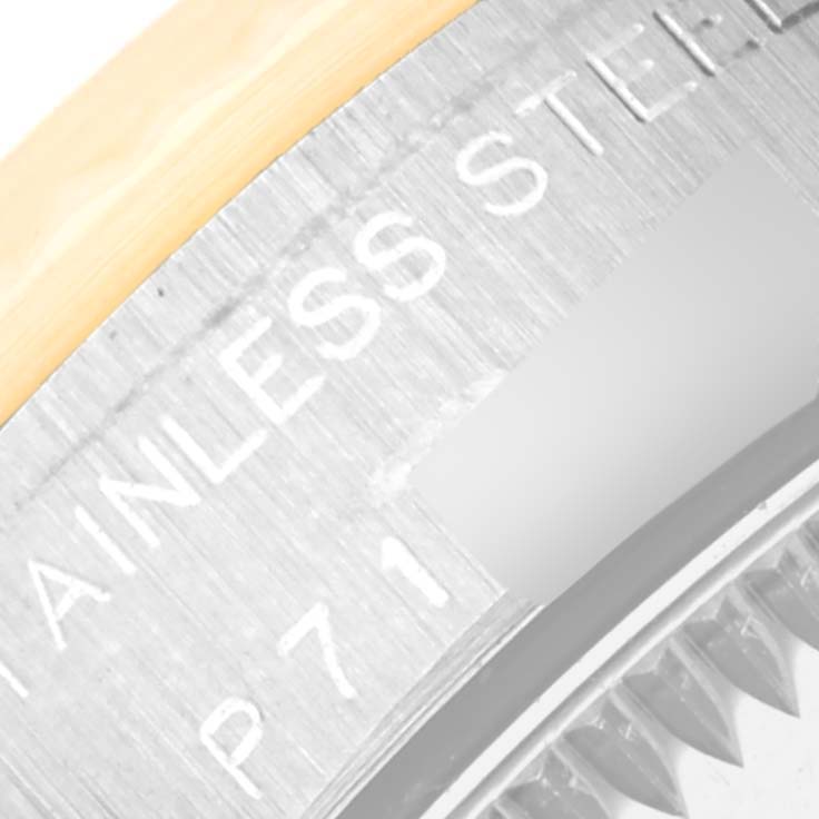 This close-up image shows the stainless steel engraved caseback edge of a Rolex Oyster Perpetual 76193 Women's Steel and Gold (two tone) White Dial 76193 Women's Steel and Gold (two tone) White Dial watch.