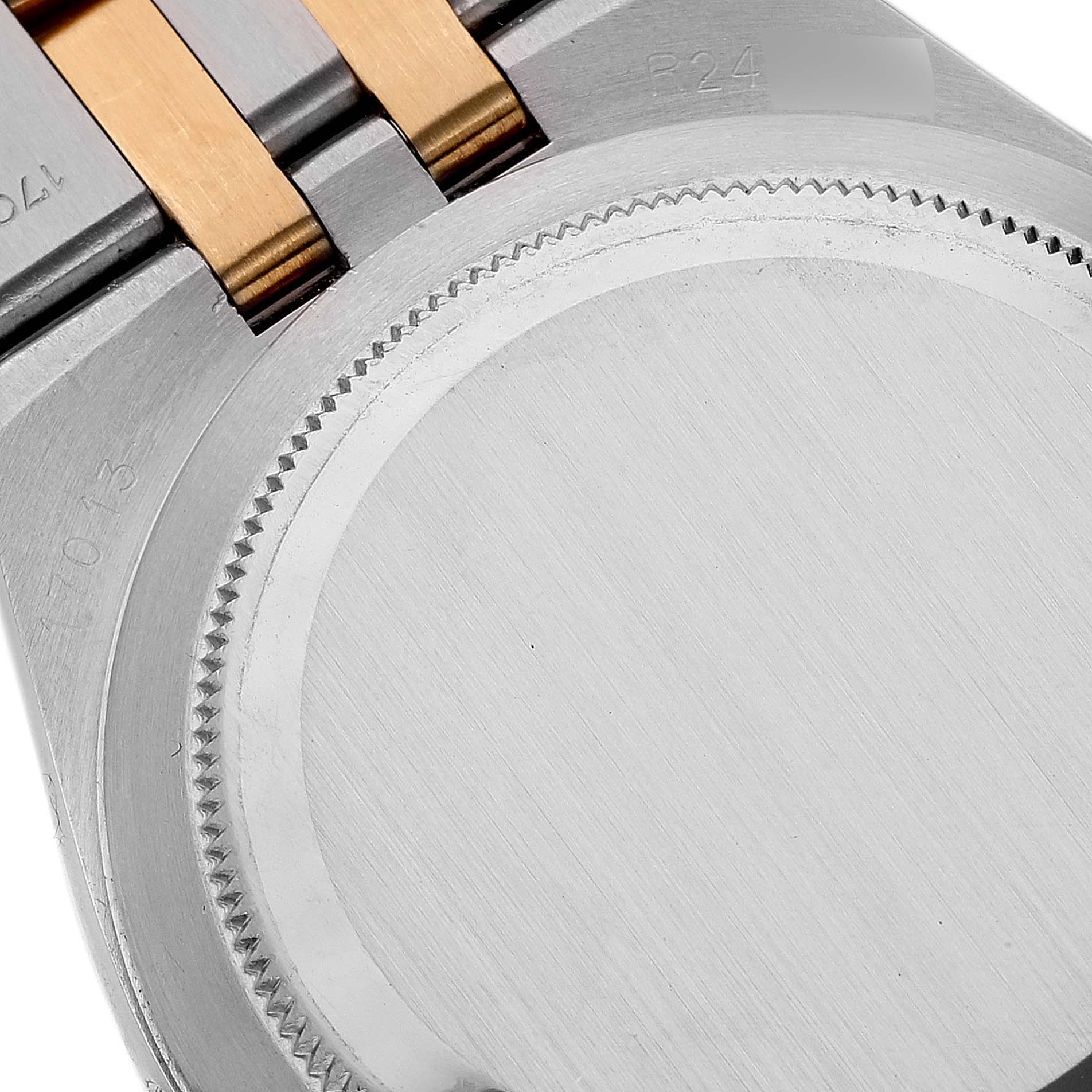 This image shows the case back and part of the bracelet of a Rolex Oysterquartz 17013 Men's Steel and Gold (two tone) Champagne Dial 17013 Men's Steel and Gold (two tone) Champagne Dial watch, viewed from the rear.