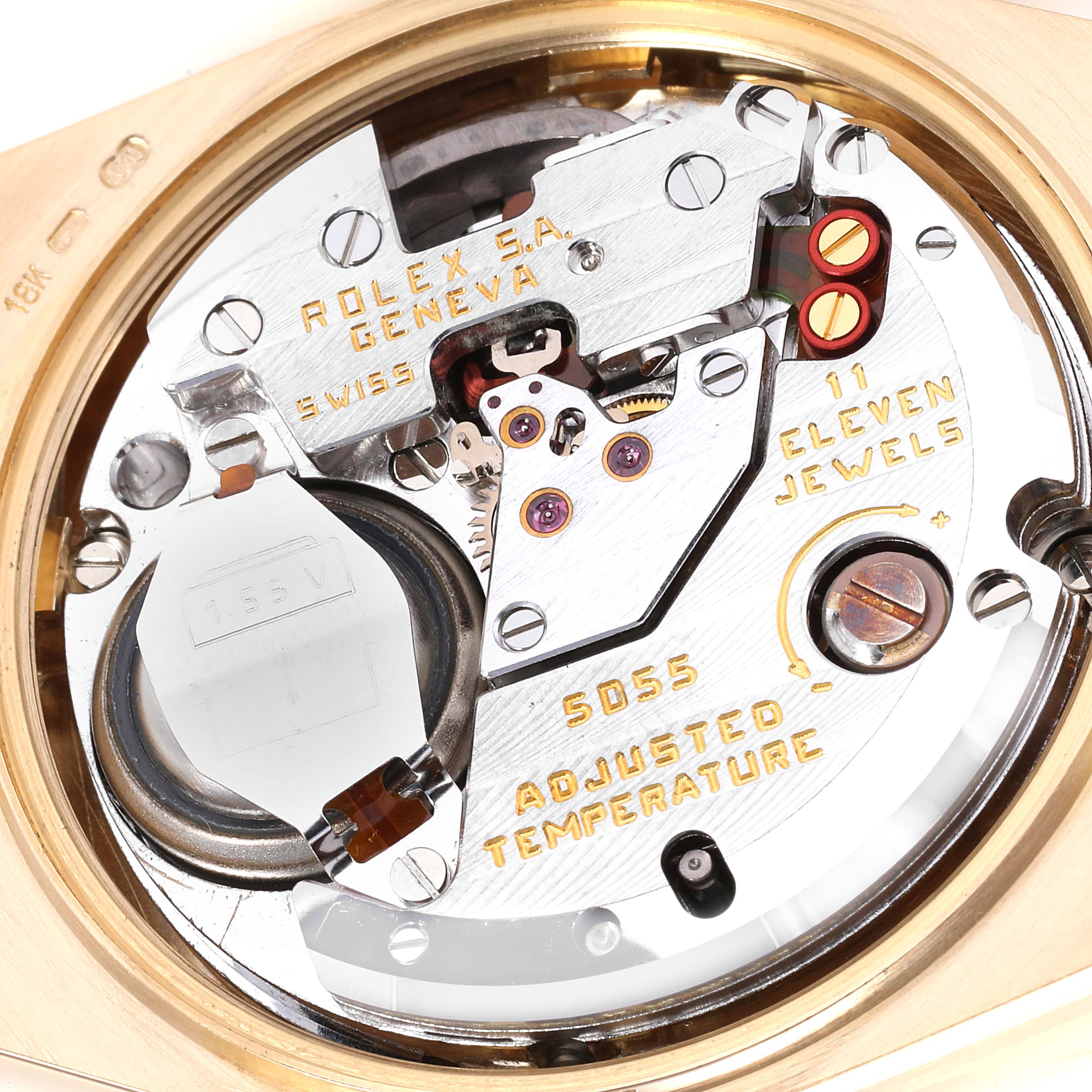 This image shows the internal mechanism of a Rolex Oysterquartz 19018 Men
s Yellow Gold Champagne Dial 19018 Men
s Yellow Gold Champagne Dial watch from a close-up, angled top view.