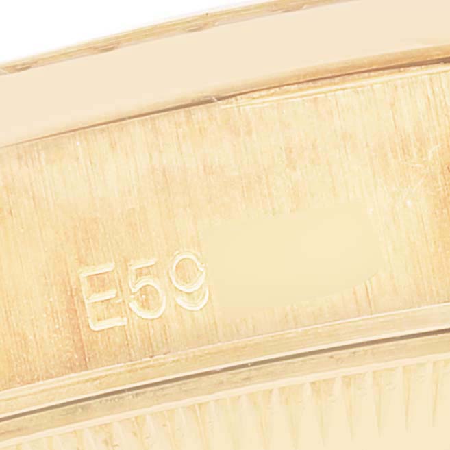 The image shows a close-up of the inner case of a Rolex President 69198 Women
s Yellow Gold  69198 Women
s Yellow Gold  model watch, highlighting the engraving.