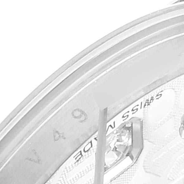 This close-up angle of the Rolex President 179159 Women's White Gold Silver Dial 179159 Women's White Gold Silver Dial model watch shows part of the dial and the inner bezel.
