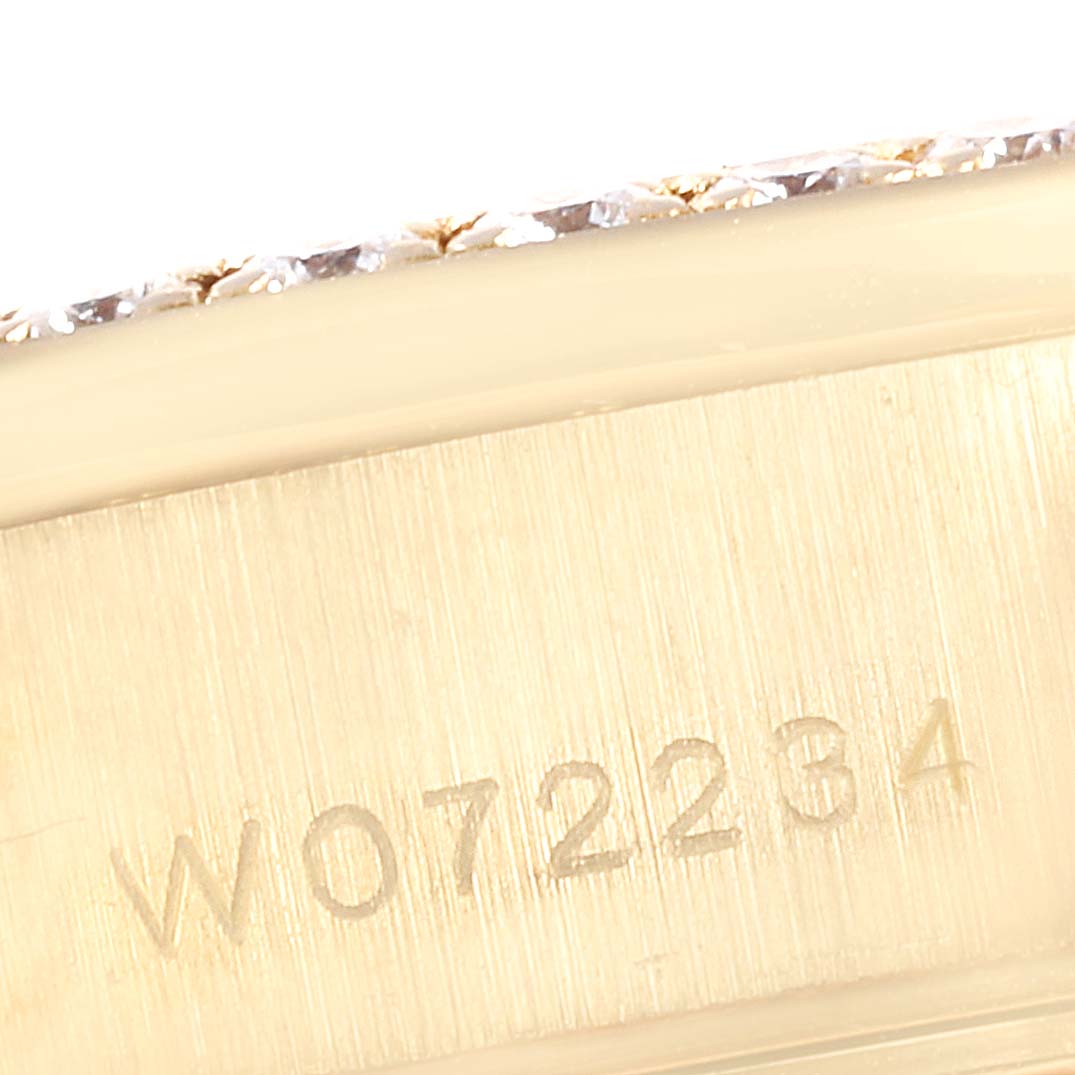 This image shows the engraved serial number on the side of the Rolex President 69238 Women's Yellow Gold Champagne Dial 69238 Women's Yellow Gold Champagne Dial watch.