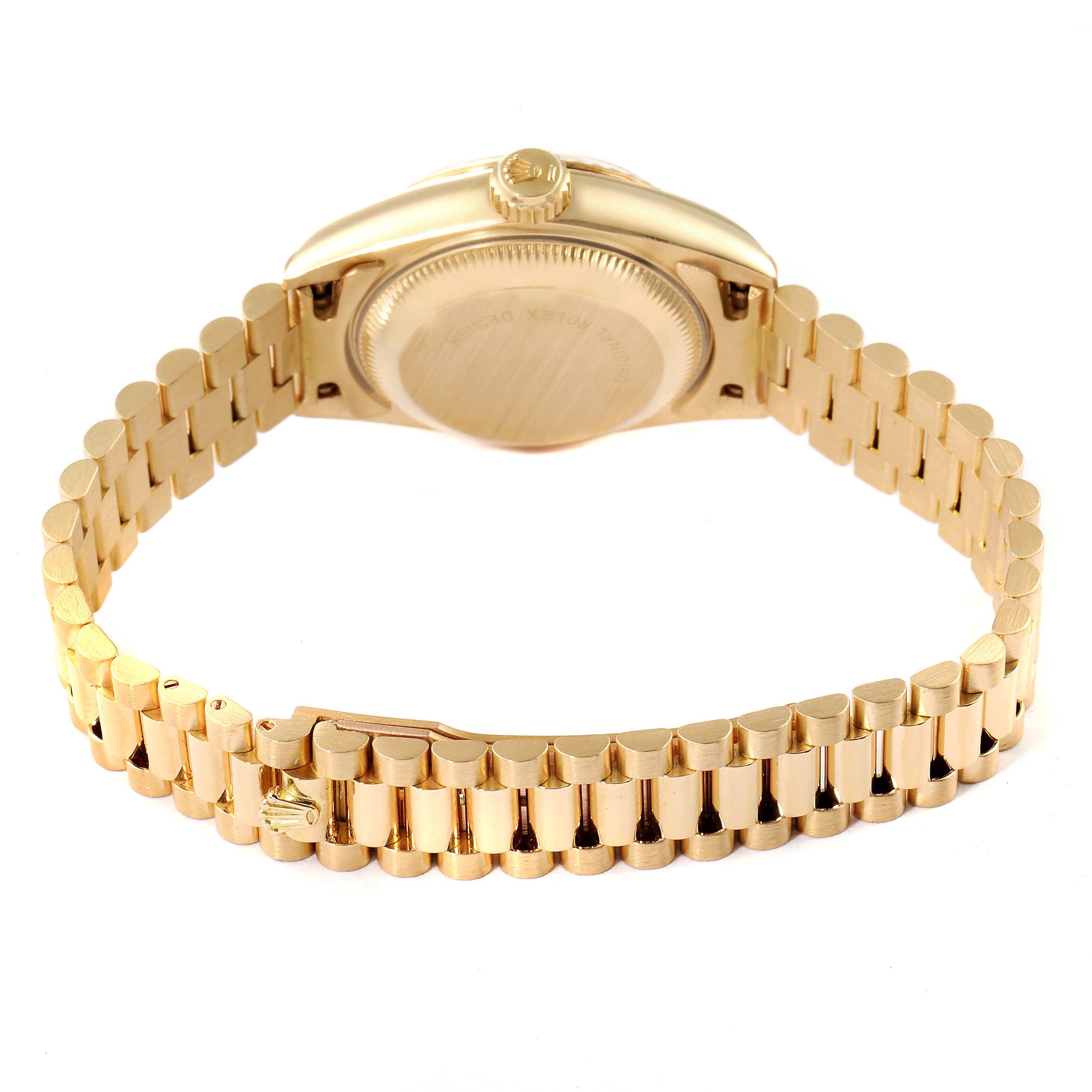 This image shows the back view of a Rolex President 69178 Women's Yellow Gold Champagne Dial 69178 Women's Yellow Gold Champagne Dial model watch, highlighting its case back and gold bracelet.