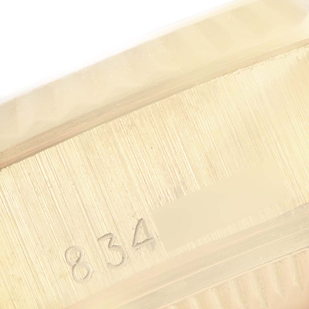 This image shows a close-up view of the case edge with markings on a Rolex President 69178 Women's Yellow Gold Champagne Dial 69178 Women's Yellow Gold Champagne Dial model watch.