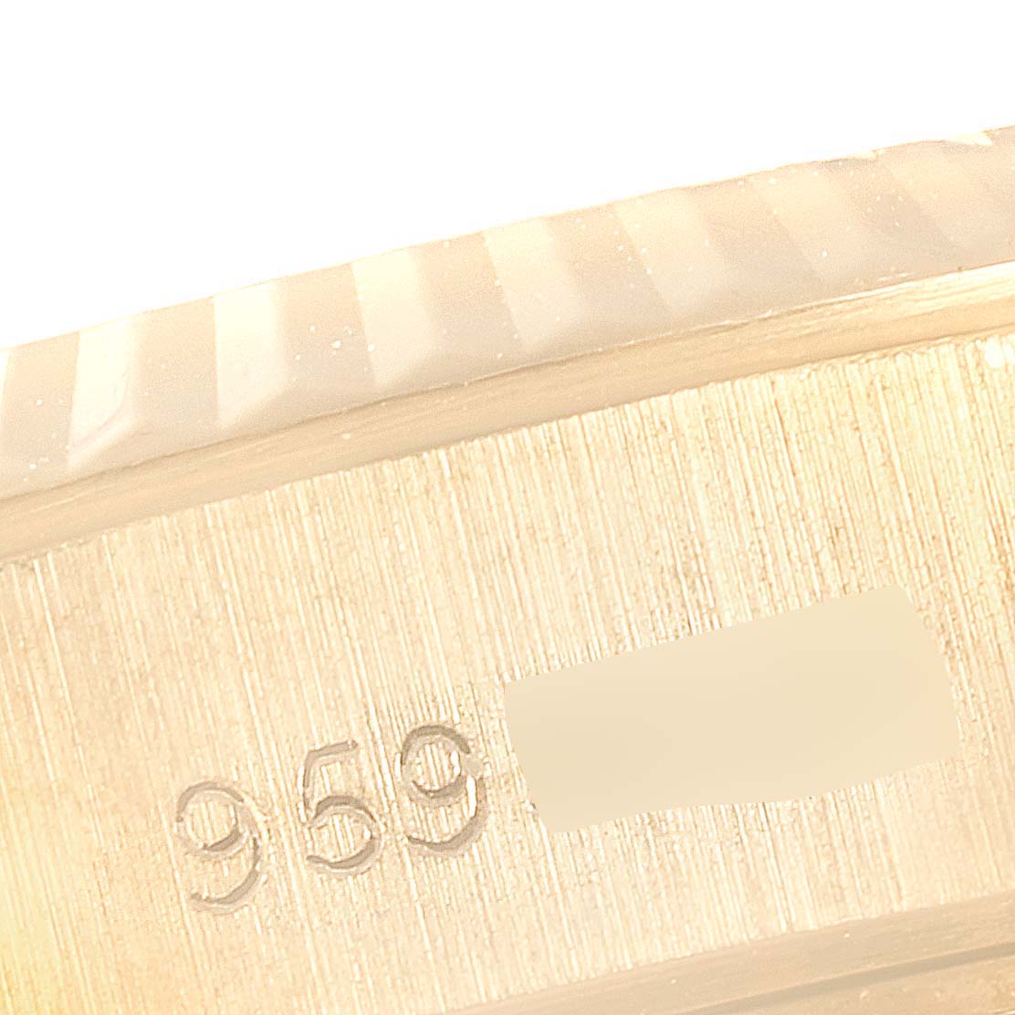 This image shows a close-up view of the serial number area on the case of a Rolex President 69178 Women's Yellow Gold Silver Dial 69178 Women's Yellow Gold Silver Dial watch.