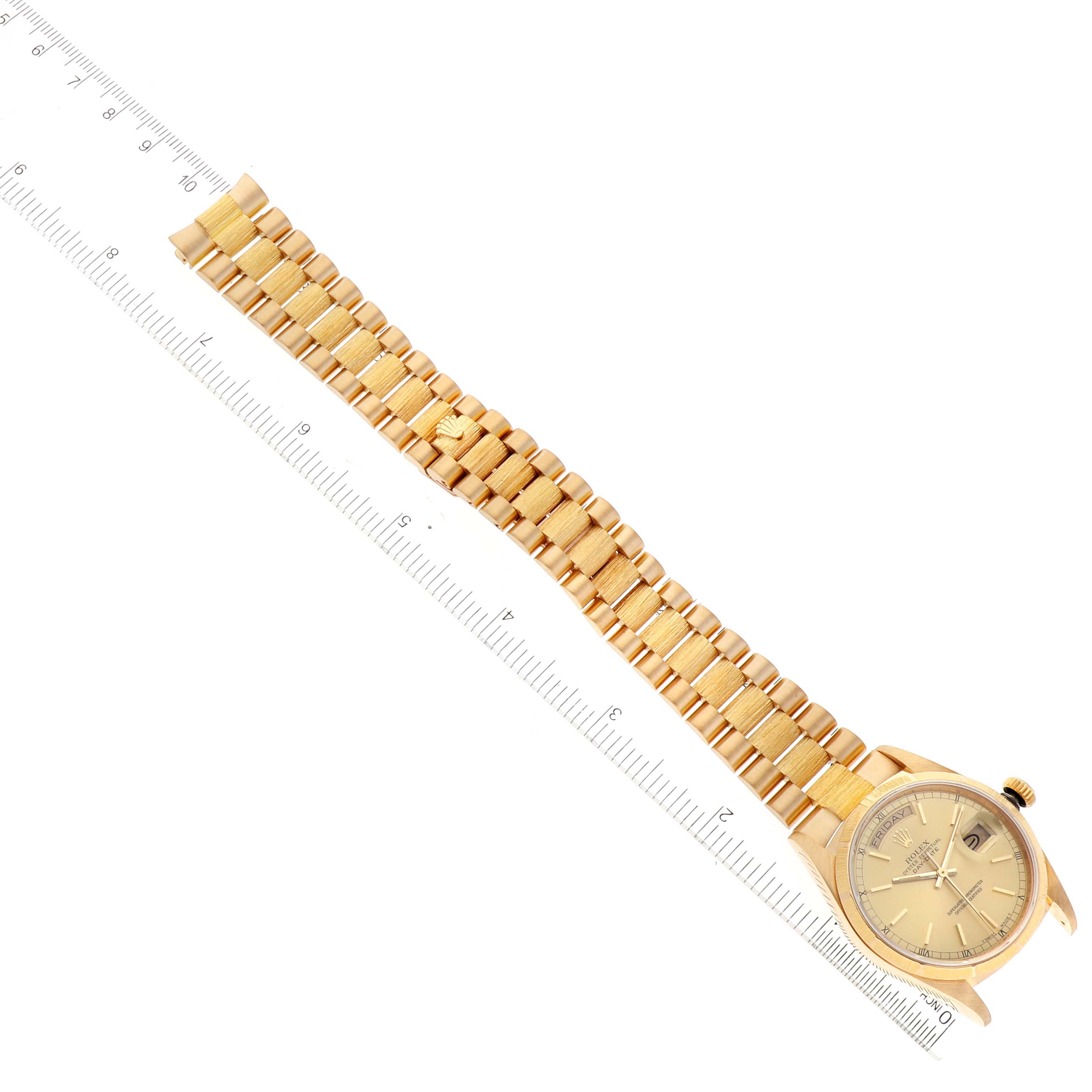 The Rolex President 18078 Men
s Yellow Gold Champagne Dial 18078 Men
s Yellow Gold Champagne Dial model watch is shown from an overhead angle, highlighting the gold bracelet and the dial.