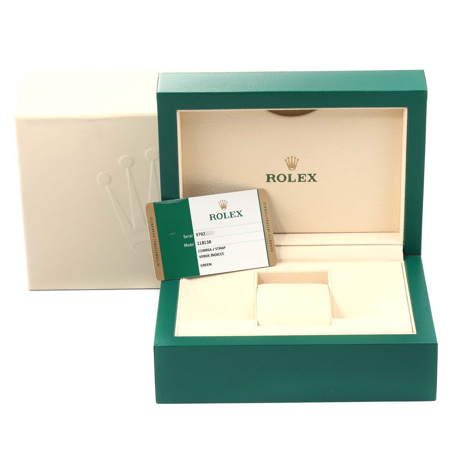 The image shows the empty box and warranty card for a Rolex President 118138 Men's Yellow Gold Green Dial 118138 Men's Yellow Gold Green Dial model watch.