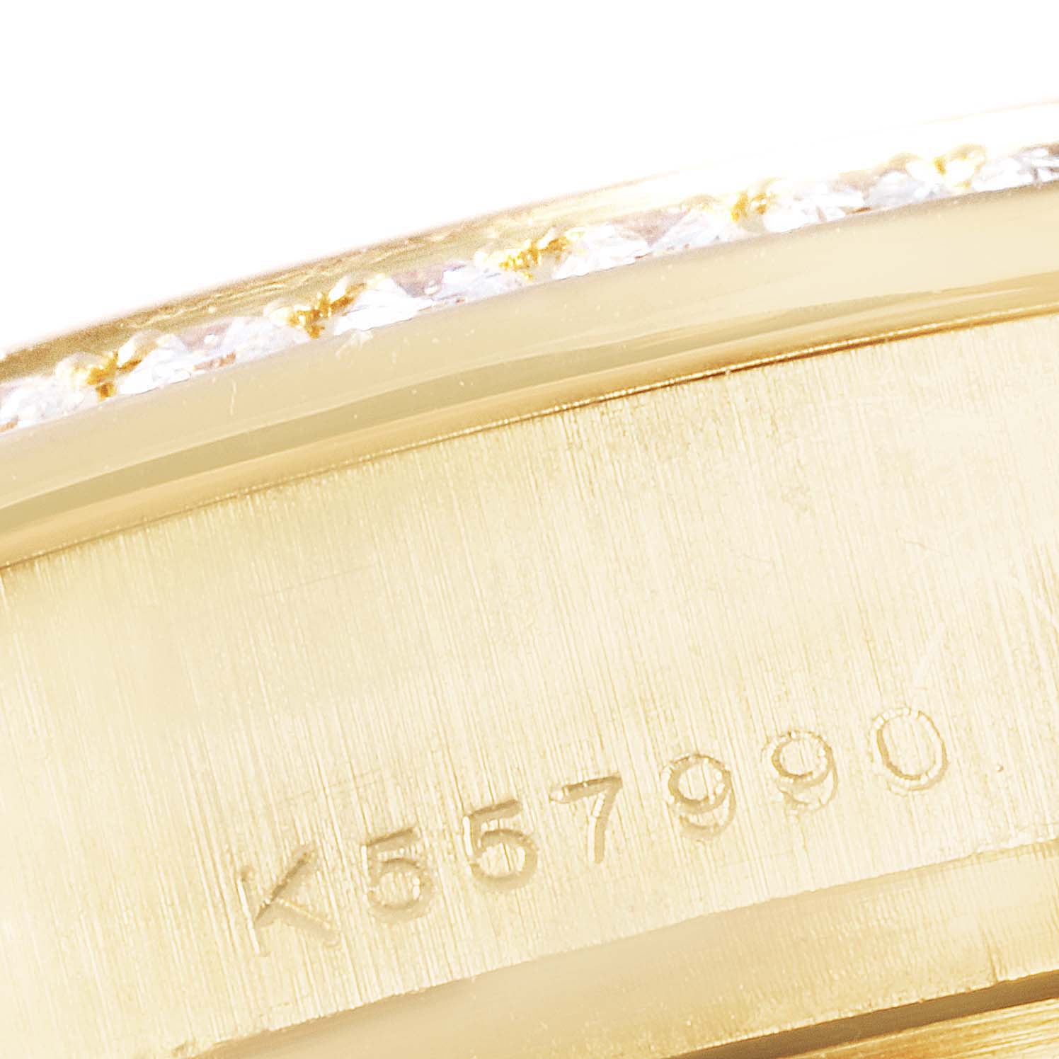 This image shows a close-up of the serial number on the gold casing of a Rolex President 179138 Women
s Yellow Gold White Dial 179138 Women
s Yellow Gold White Dial model watch.