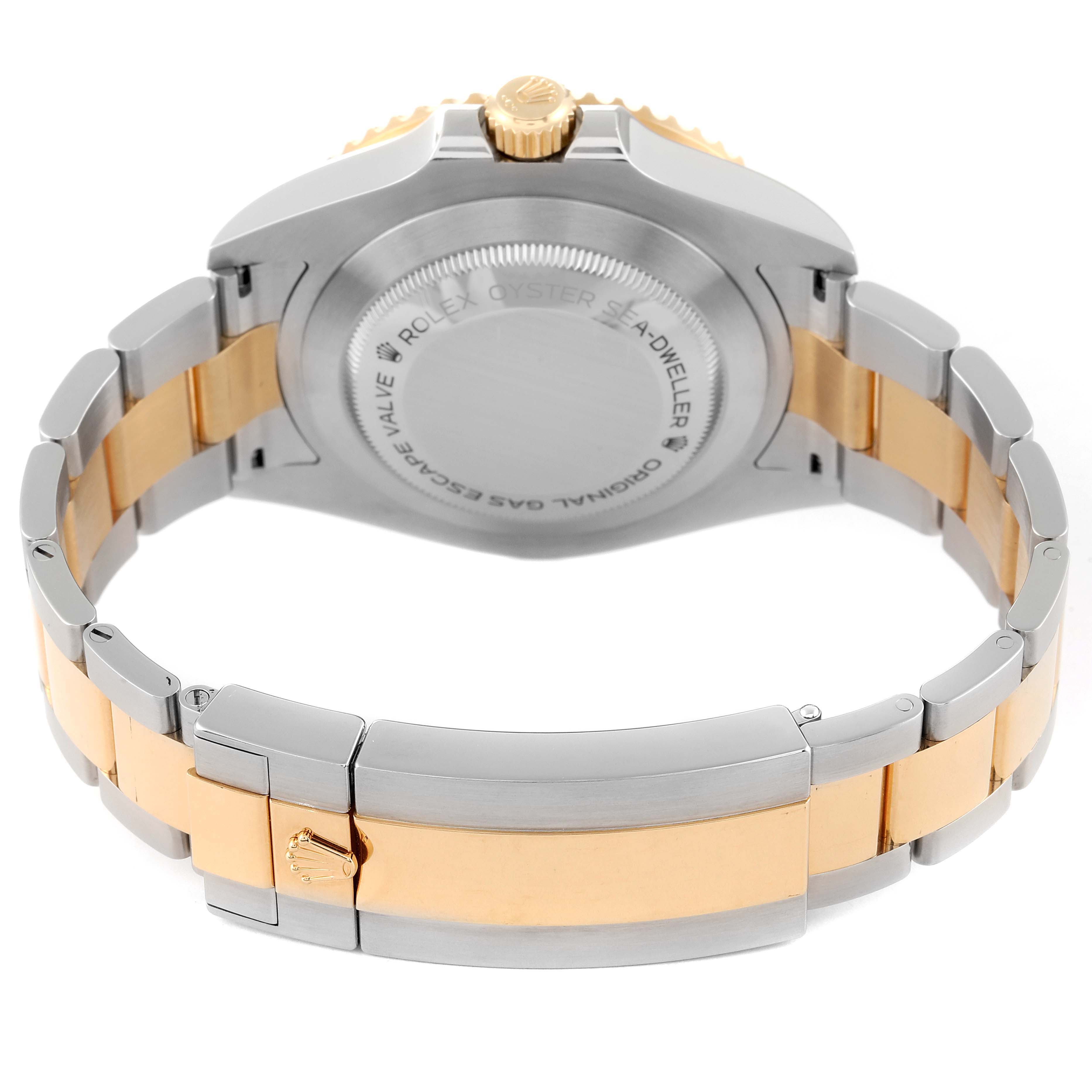 The image shows the back case and bracelet of the Rolex Sea-Dweller 126603 Men's Steel and Gold (two tone) Black Dial 126603 Men's Steel and Gold (two tone) Black Dial watch, focusing on the clasp and two-tone metal design.