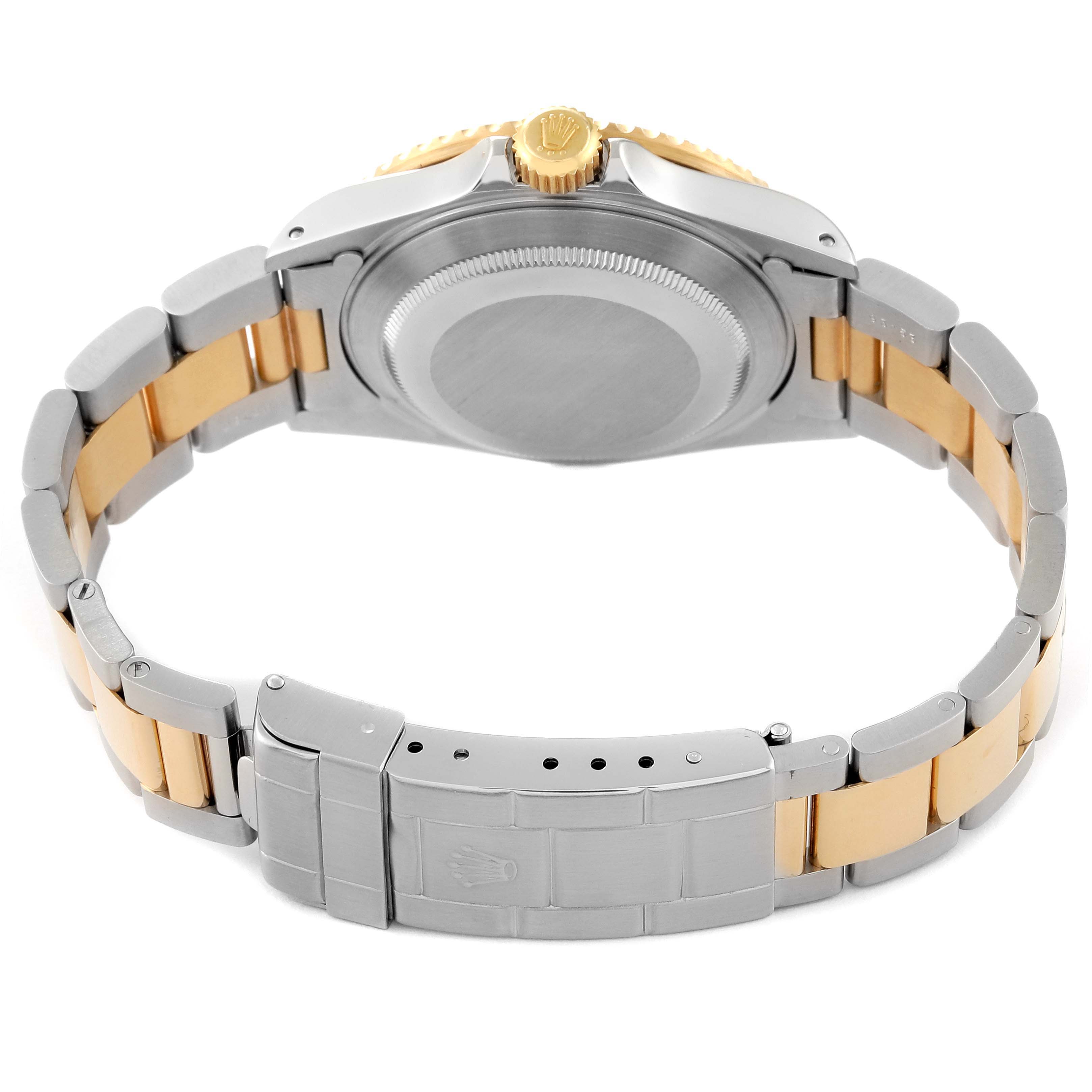 The image shows the back and bracelet of a Rolex Submariner 16613 Men's Steel and Gold (two tone) Blue Dial 16613 Men's Steel and Gold (two tone) Blue Dial watch, highlighting the clasp and crown.