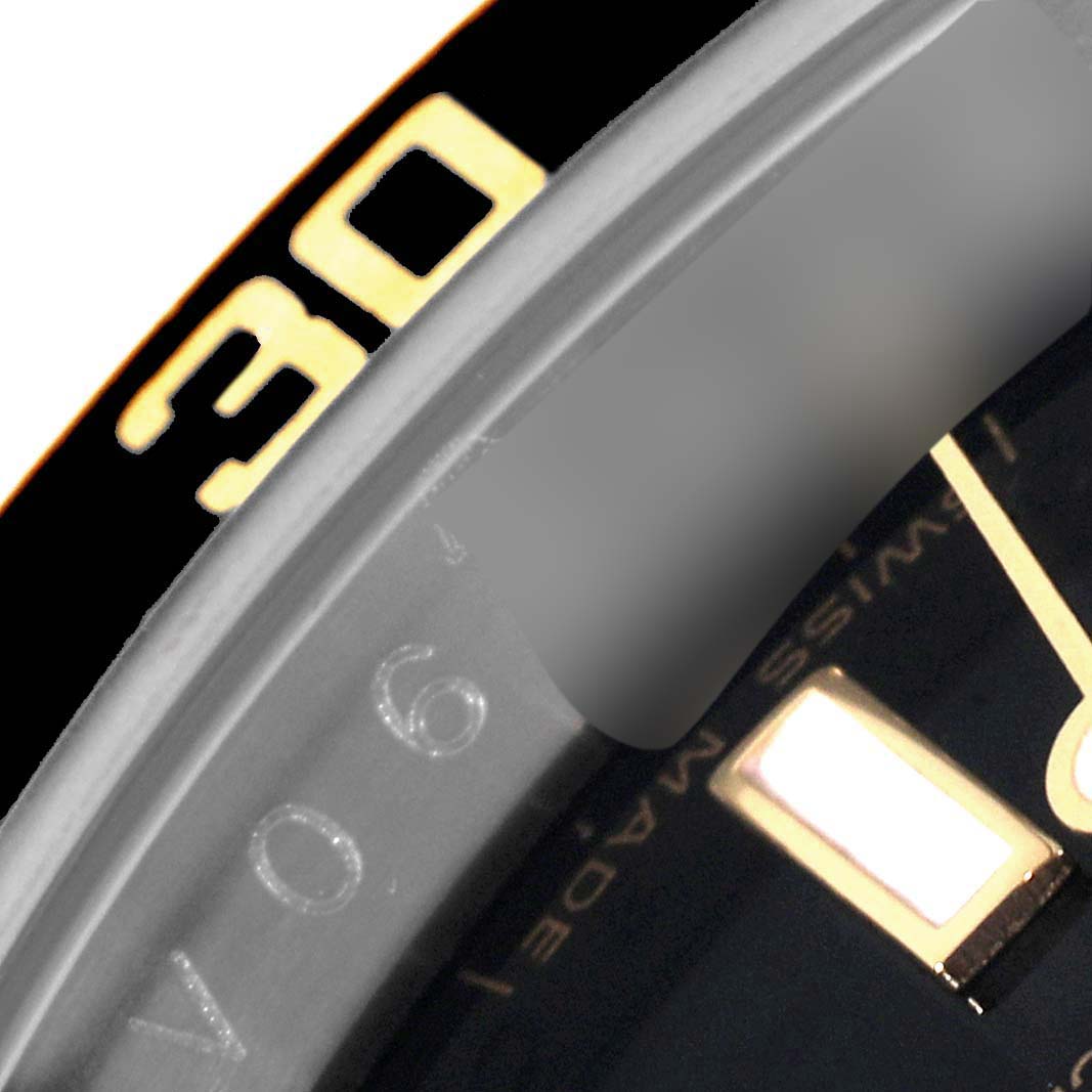The image shows a close-up angle of the bezel and part of the dial of a Rolex Submariner 16613LN Men's Steel and Gold (two tone) Mother of Pearl Dial 16613LN Men's Steel and Gold (two tone) Mother of Pearl Dial watch.